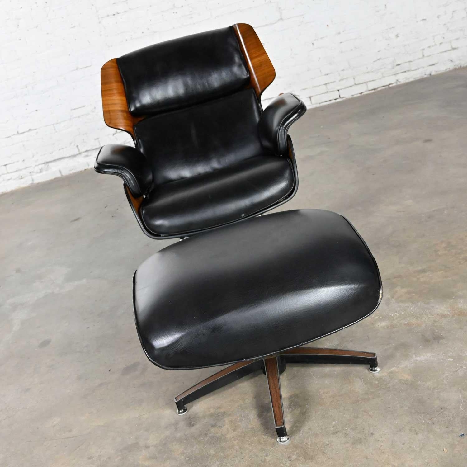 Stunning Drexel Declaration molded plywood and black faux leather lounge chair and ottoman by Kipp Stewart and Stewart MacDougall. Beautiful condition, keeping in mind that these are vintage and not new so will have signs of use and wear. There are