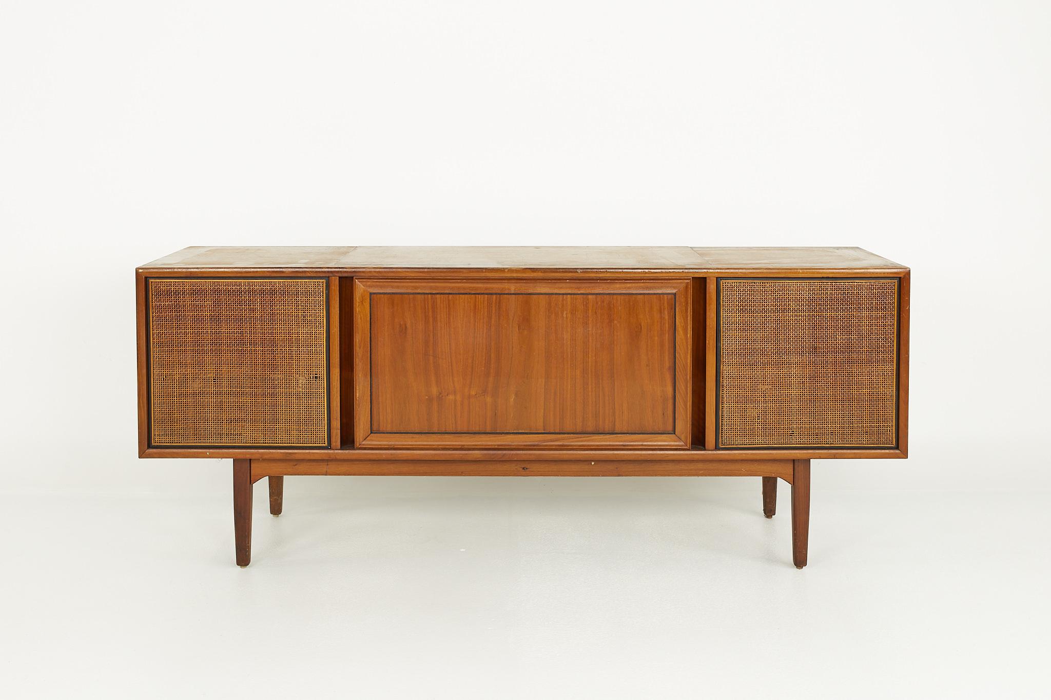 Drexel Declaration mid century walnut stereo console

This console measures: 66 wide x 17.75 deep x 26.75 inches high

?All pieces of furniture can be had in what we call restored vintage condition. That means the piece is restored upon purchase
