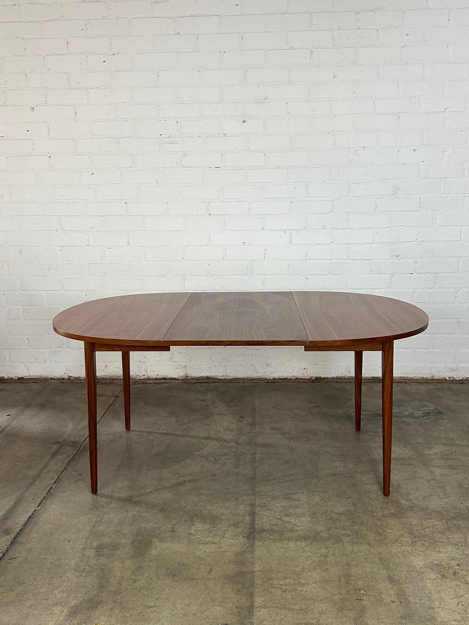 W88.25 W44.25 D44.25 H29.25 KC27.75 Leaf W22

Fully restored dining table with two extensions. Table has great bulbous round shape when closed. Table has two large extensions and is structurally sound and sturdy. 

