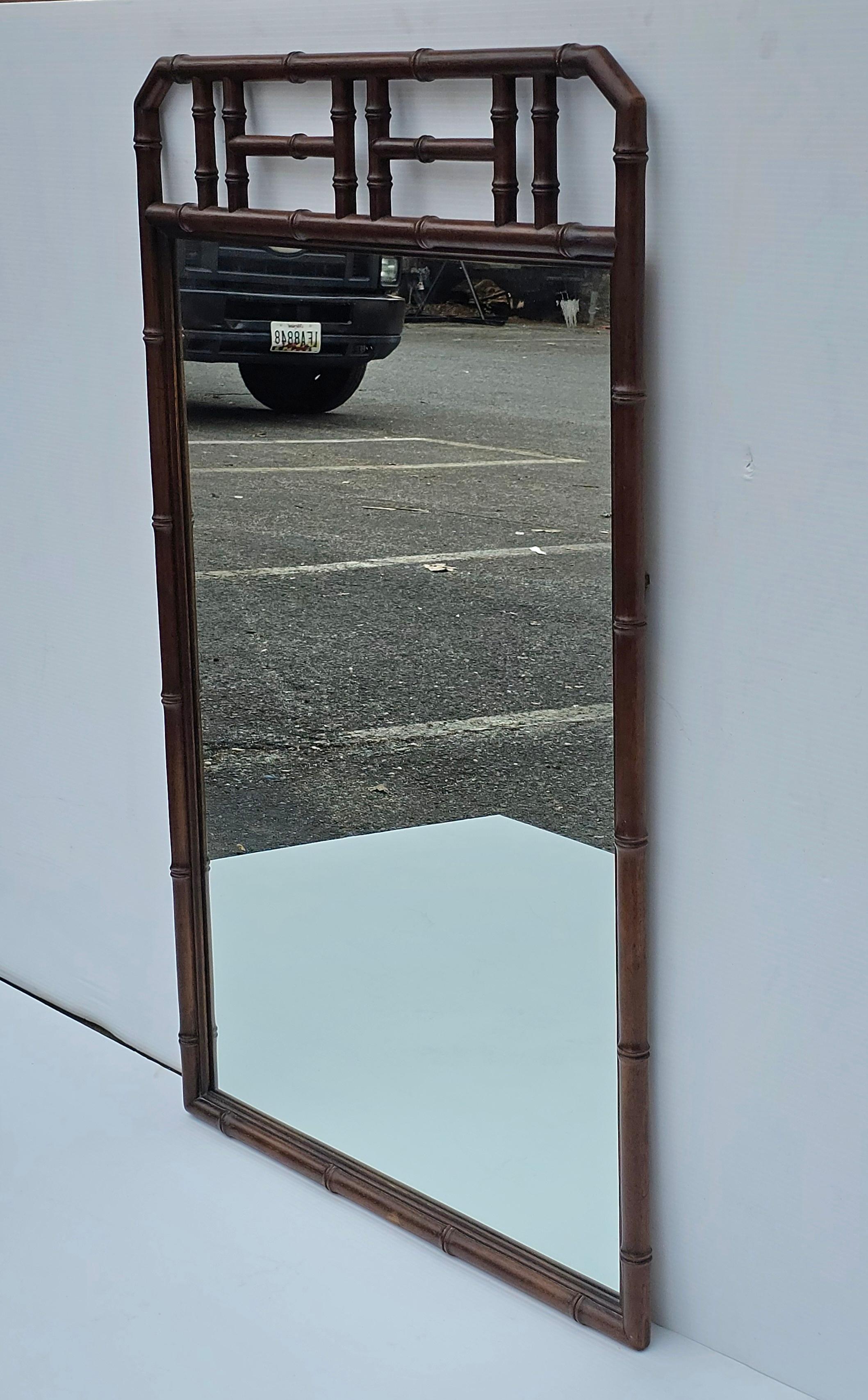 A clean Mid Century Drexel Hollywood Regency Faux Bamboo Tortoise Shell Wood Mirror
Measures 28.25