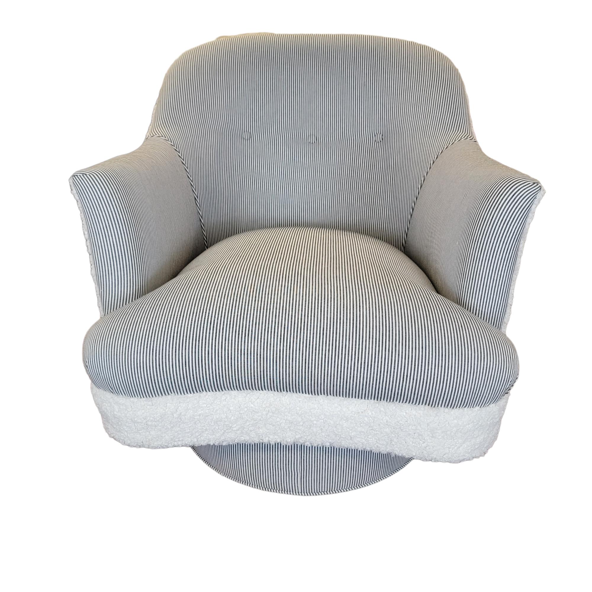Generously sized swivel chair by Drexel with firm back support and tight cushion newly reupholstered in ticking and faux shearling. There is no loose cushion. Attractive 'serpentine' curve seat showcases the front elegantly. Ideal seating for