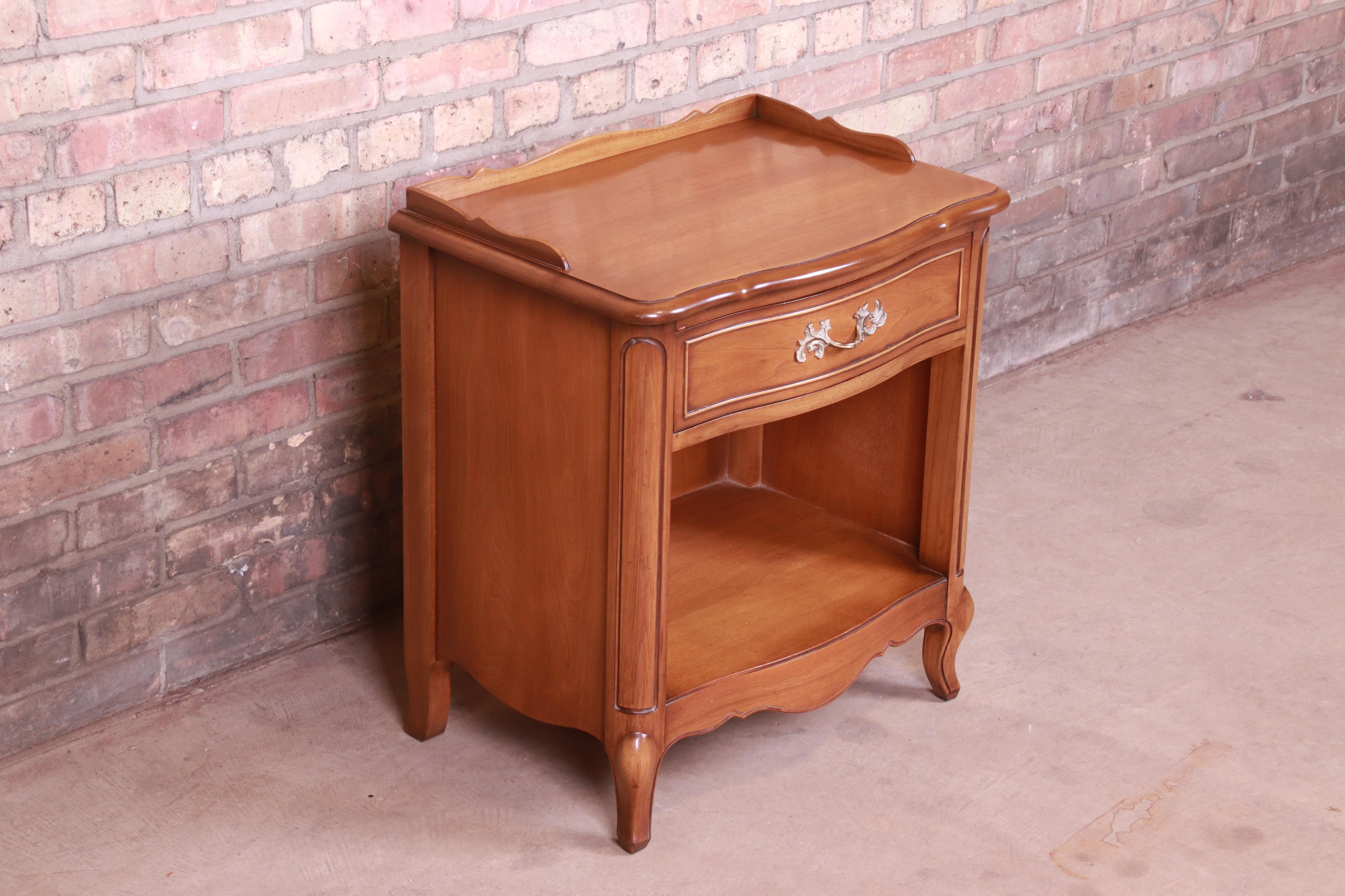 Brass Drexel French Provincial Louis XV Carved Walnut Nightstand, circa 1950s