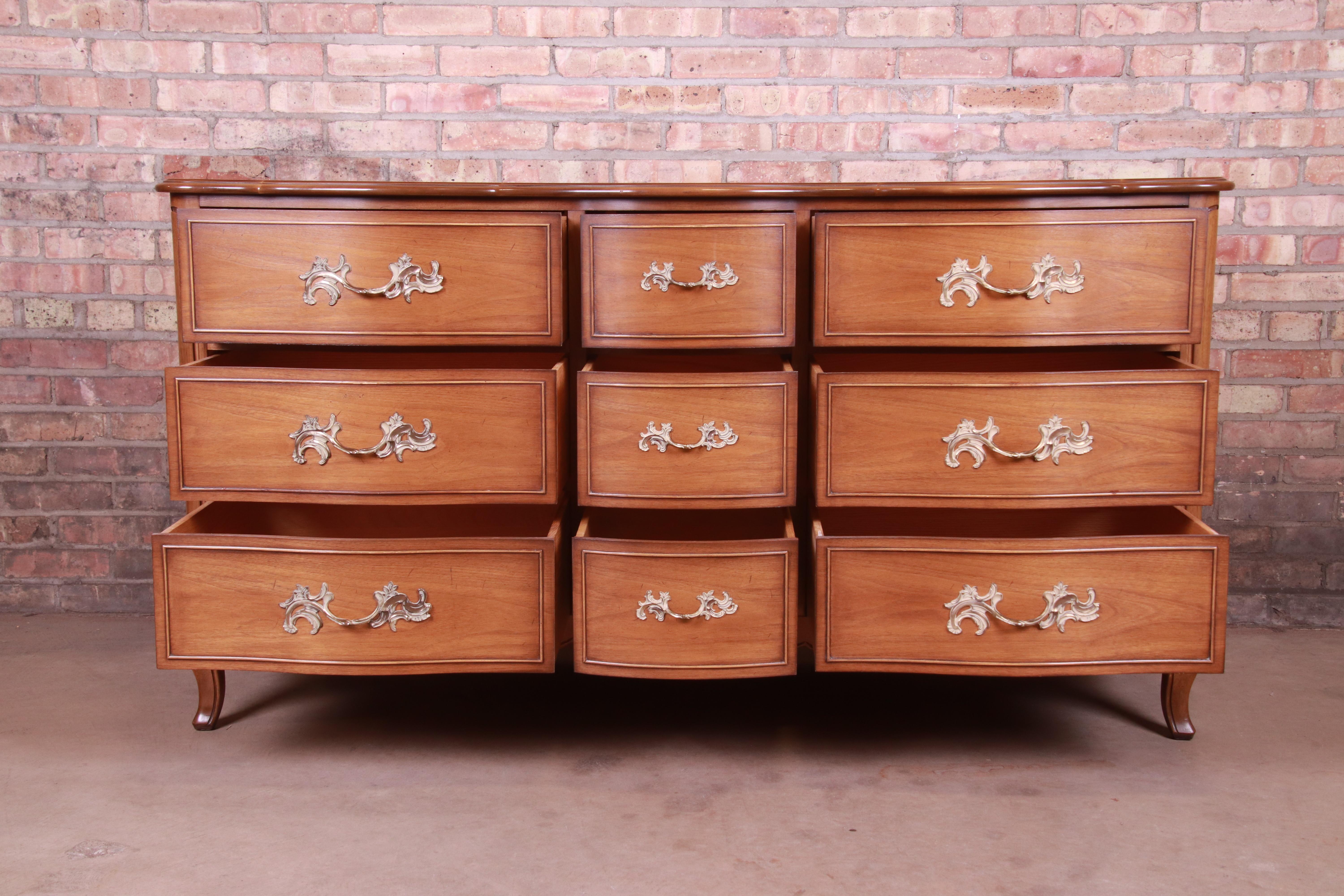 Brass Drexel French Provincial Louis XV Carved Walnut Triple Dresser, circa 1950s