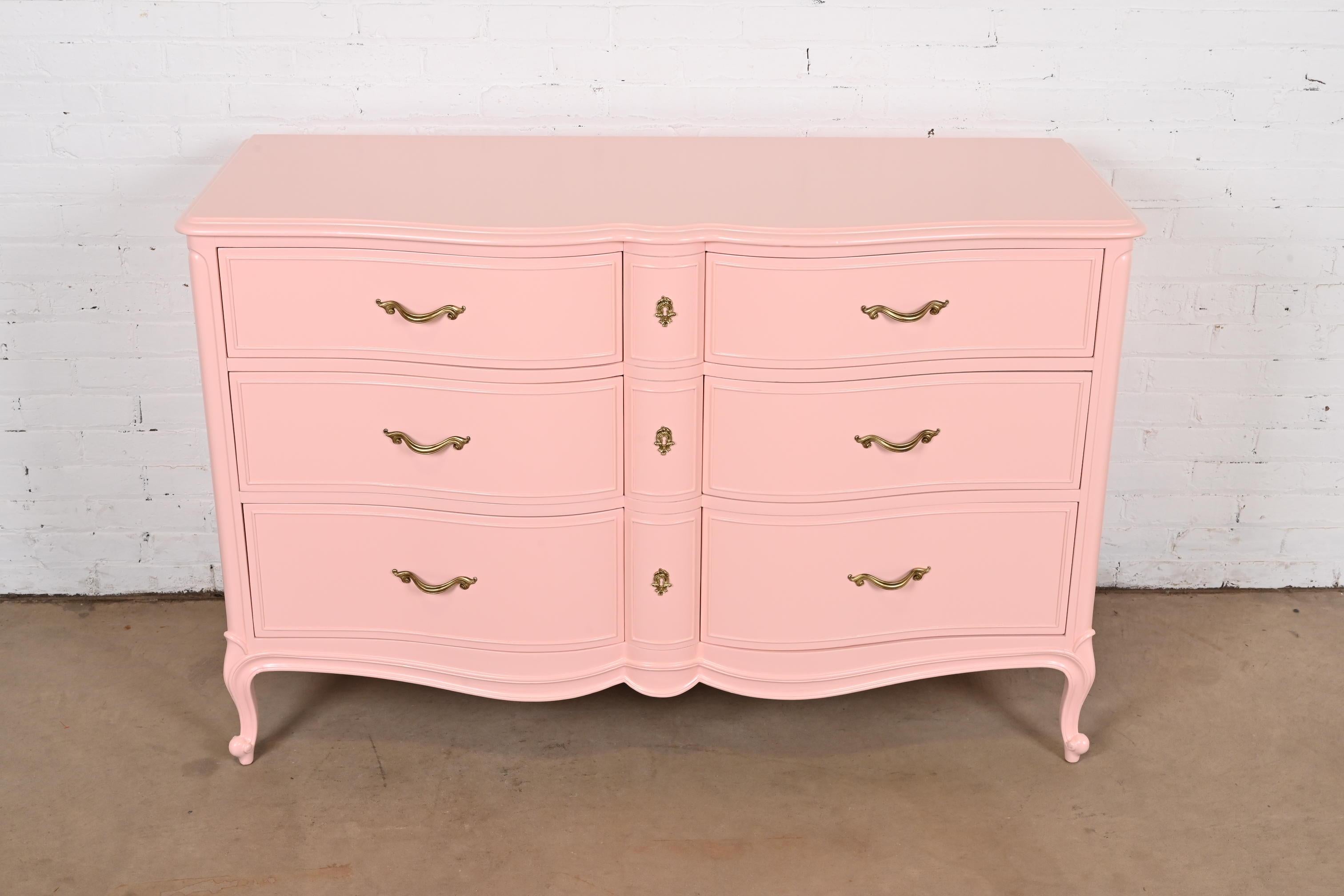 A gorgeous French Provincial Louis XV style six-drawer dresser or chest of drawers

By Drexel

USA, Circa 1960s

Pink lacquered cherry wood, with original brass hardware.

Measures: 54