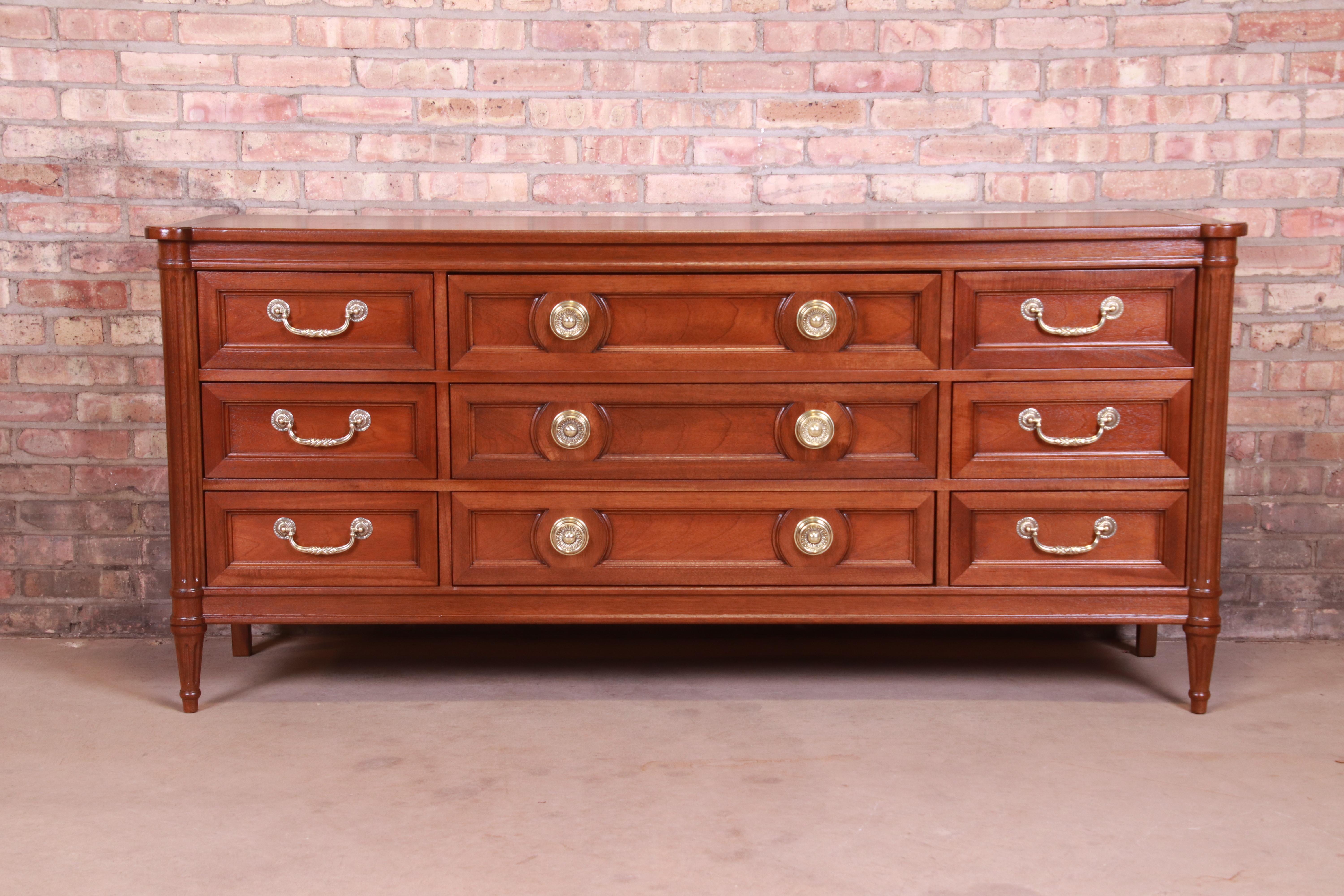 A gorgeous French Regency Louis XVI style triple dresser or credenza

By Drexel 