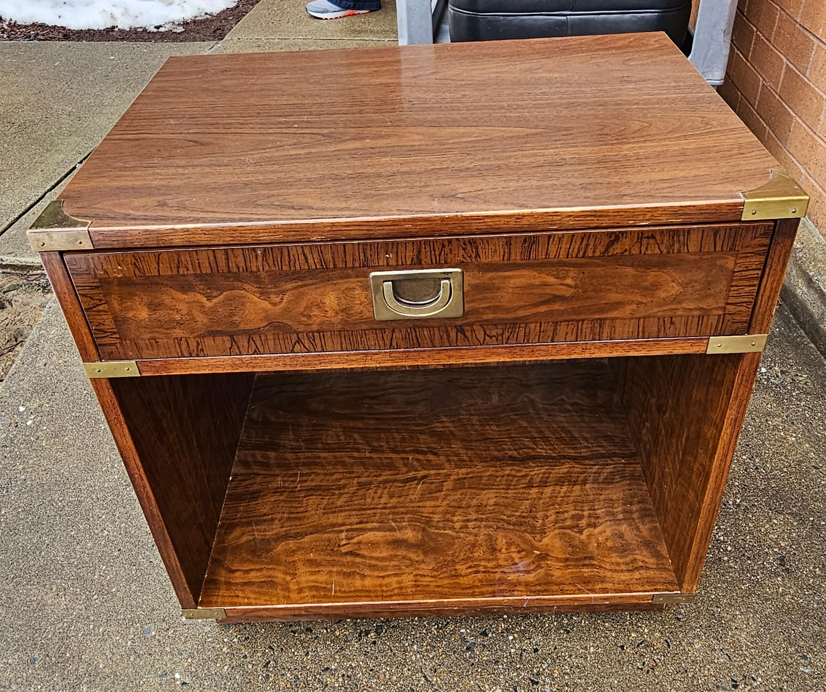 A Mid Century Single drawer two tier campaign bed side Table by Drexel Furniture. Good vintage condition. Measures 23.5