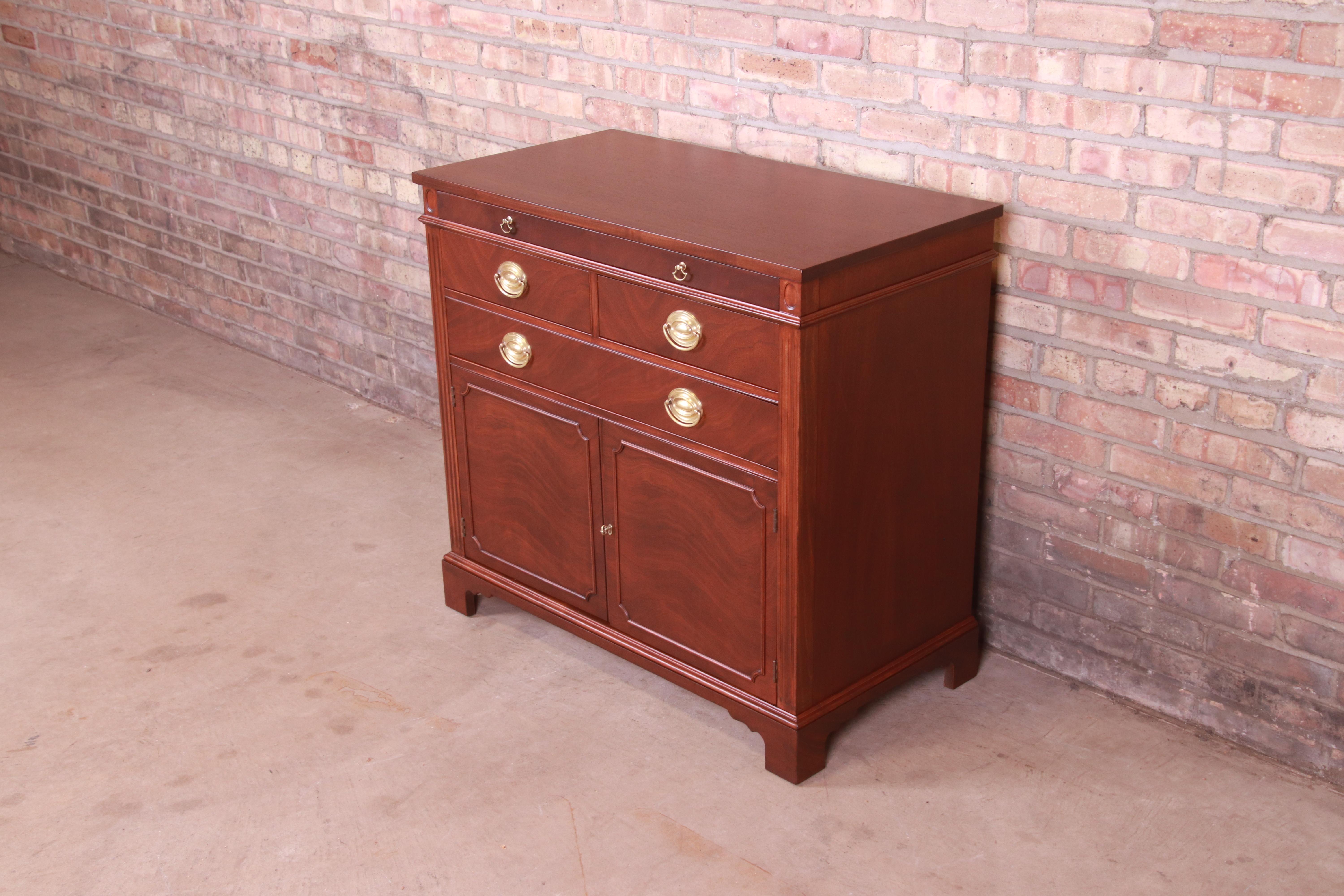 An exceptional mid-century Georgian style compact credenza, sideboard buffet, or bar cabinet

By Drexel Furniture, 
