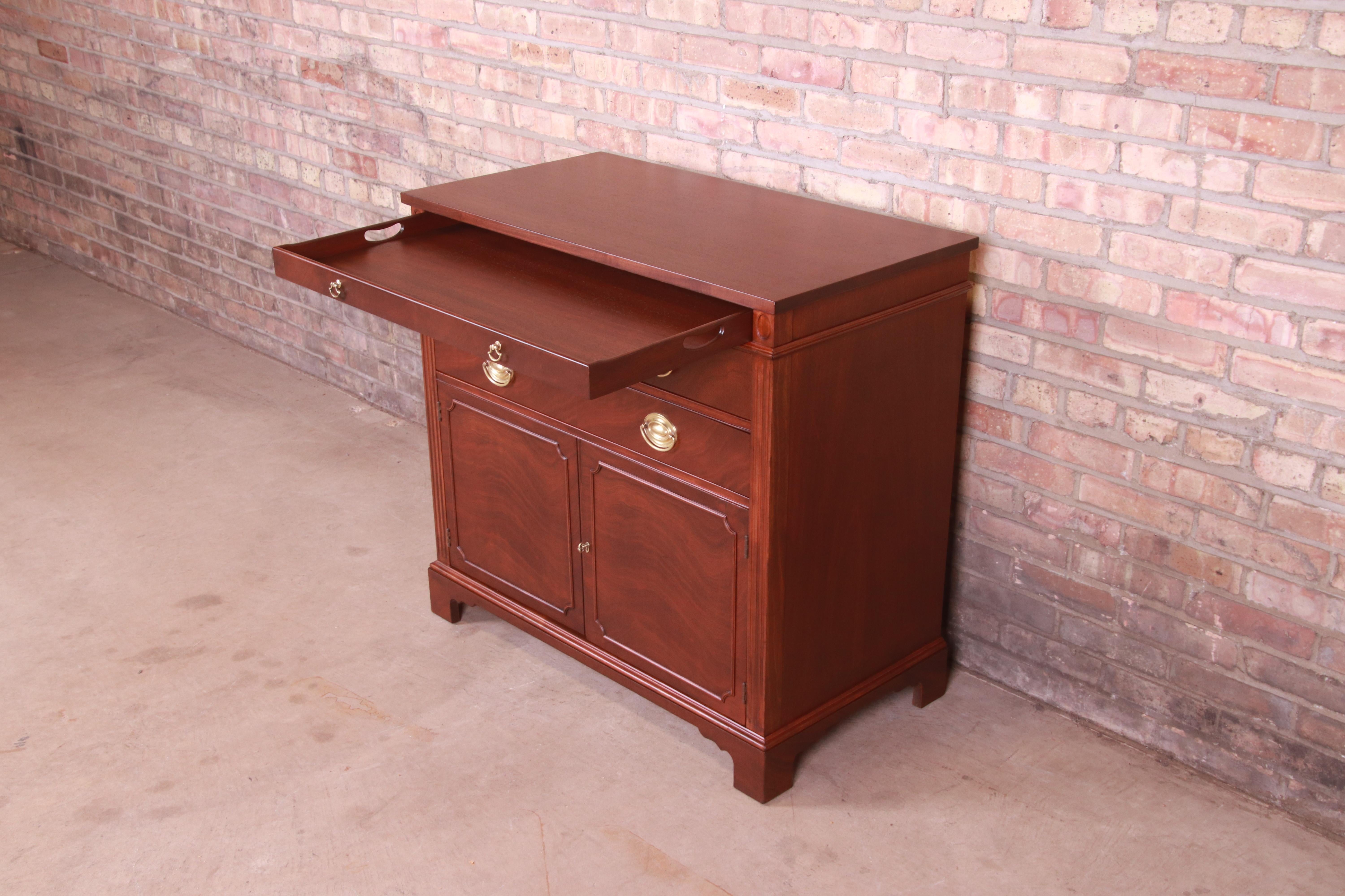 An exceptional mid-century Georgian style compact credenza, sideboard buffet, or bar cabinet

By Drexel Furniture, 