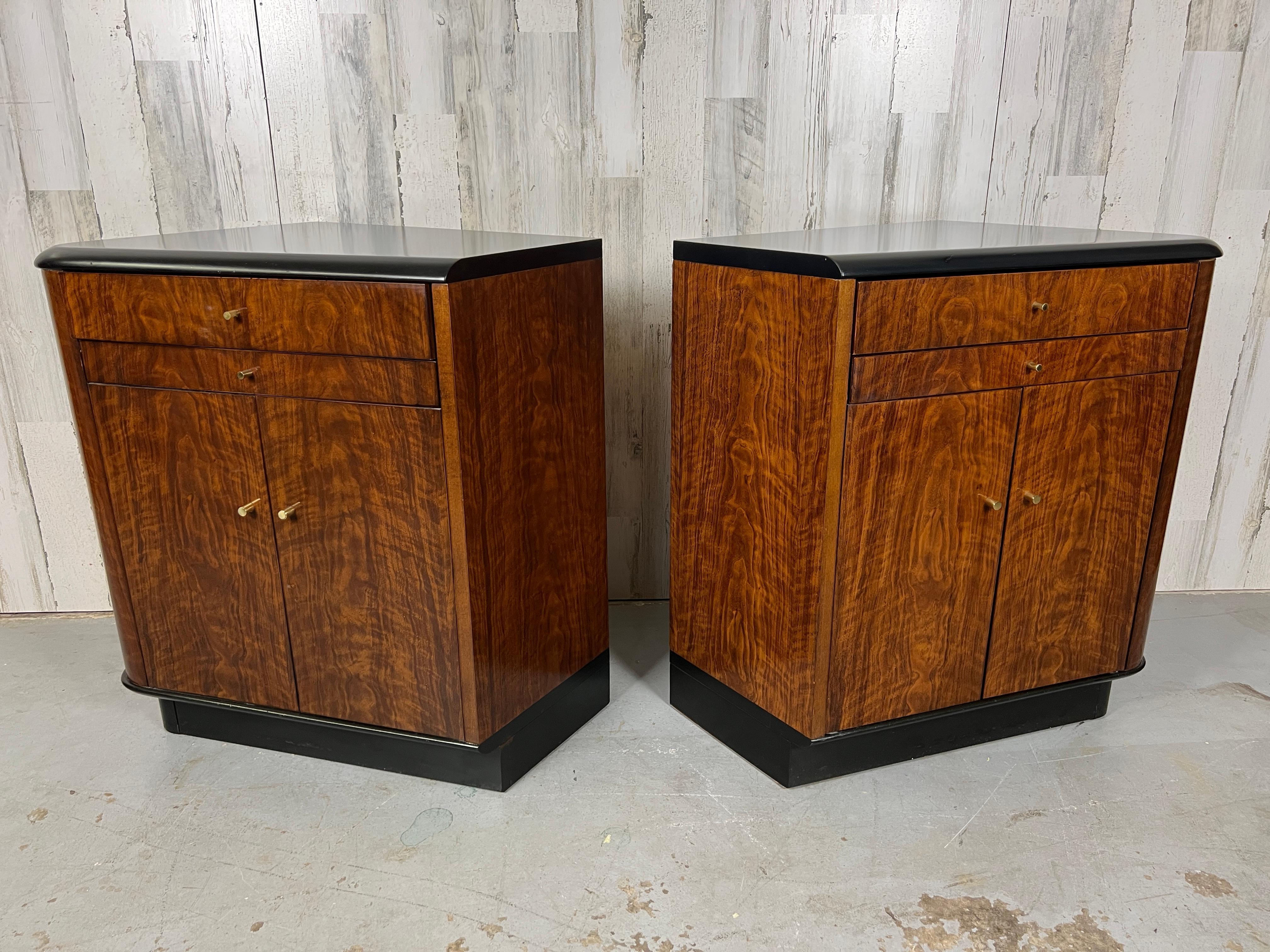 Walnut with sculpted grain and black lacquer accents make these nightstands very dramatic. With storage below and a drink shelf for nightcaps. The drink shelves are different on each side please see pictures.
