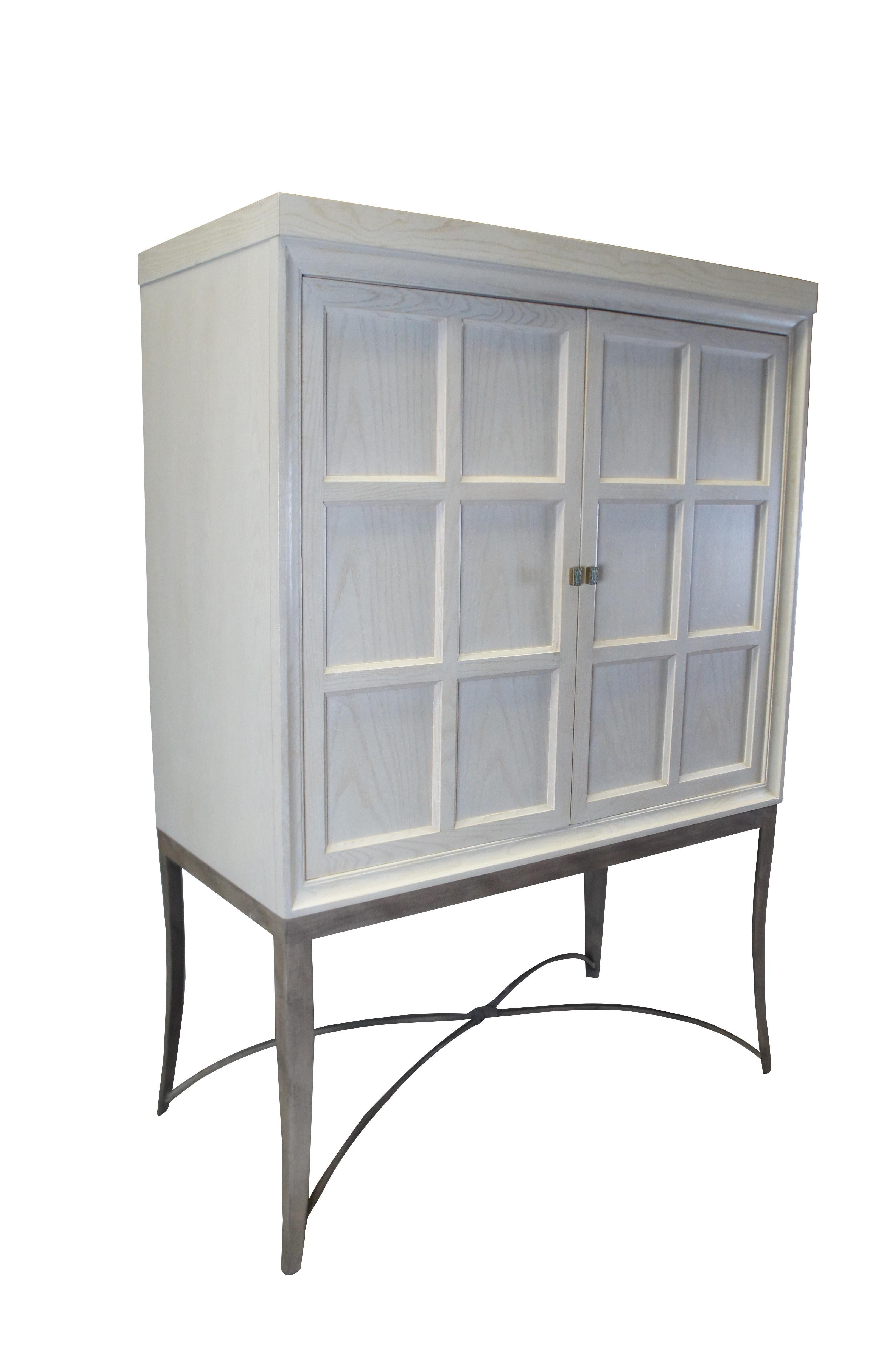 Vintage Drexel Heritage Cabochon TV console / entertainment center / bar or liquor cabinet featuring post modern styling. Made from whitewashed oak with paneled doors over an iron base. 868-960.  Very heavy.

Dimensions:
24