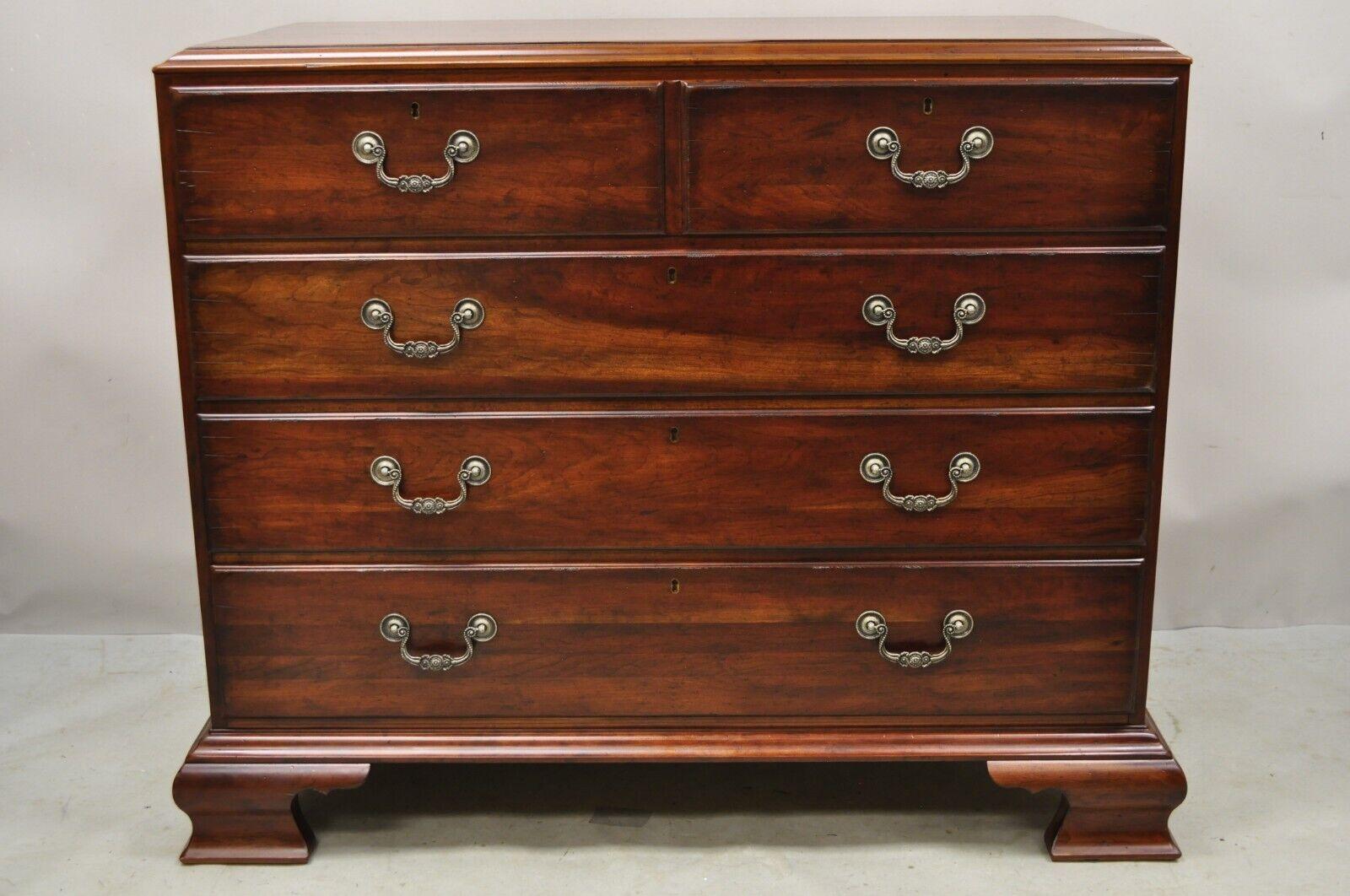 Drexel Heritage Cambridge Cherry Wood Four Drawer Dresser Chest. Item featured is a nice larger size, distressed finish, solid cherry wood construction, faux keyholes, quality American craftsmanship. Circa Late 20th Century. Measurements: 38