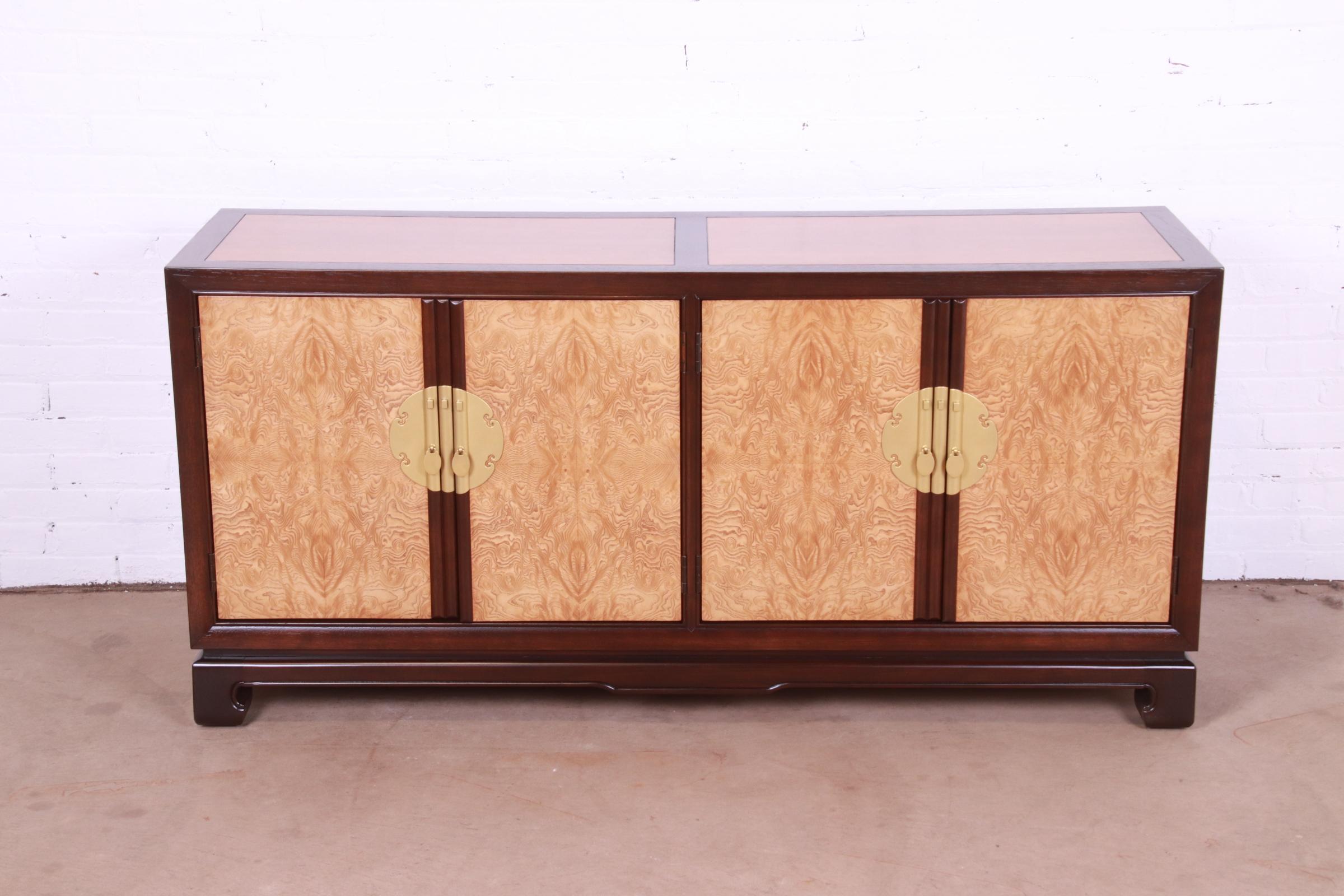 An exceptional Hollywood Regency Chinoiserie style sideboard, credenza, or bar cabinet

By Drexel Heritage

USA, 1983

Gorgeous burl wood front, with cherry wood case, mahogany banding, and original Asian-inspired brass hardware.

Measures: