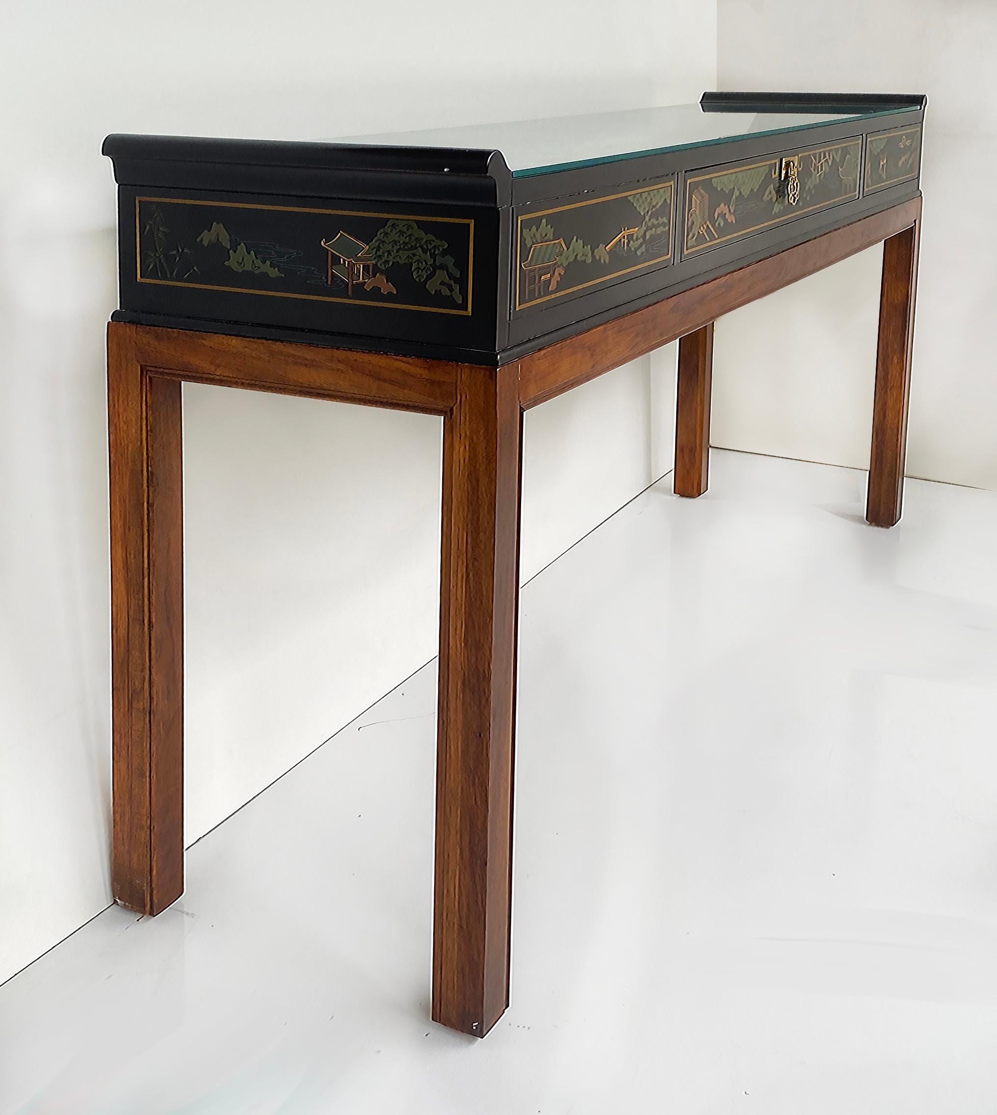 Drexel Heritage Chinoiserie Console Table, Drawer and Glass Top

Offered for sale is a Drexel Heritage console table with black lacquered painted Chinoiserie details.  The top portion appears as a slender chest that is on a brown wood base with