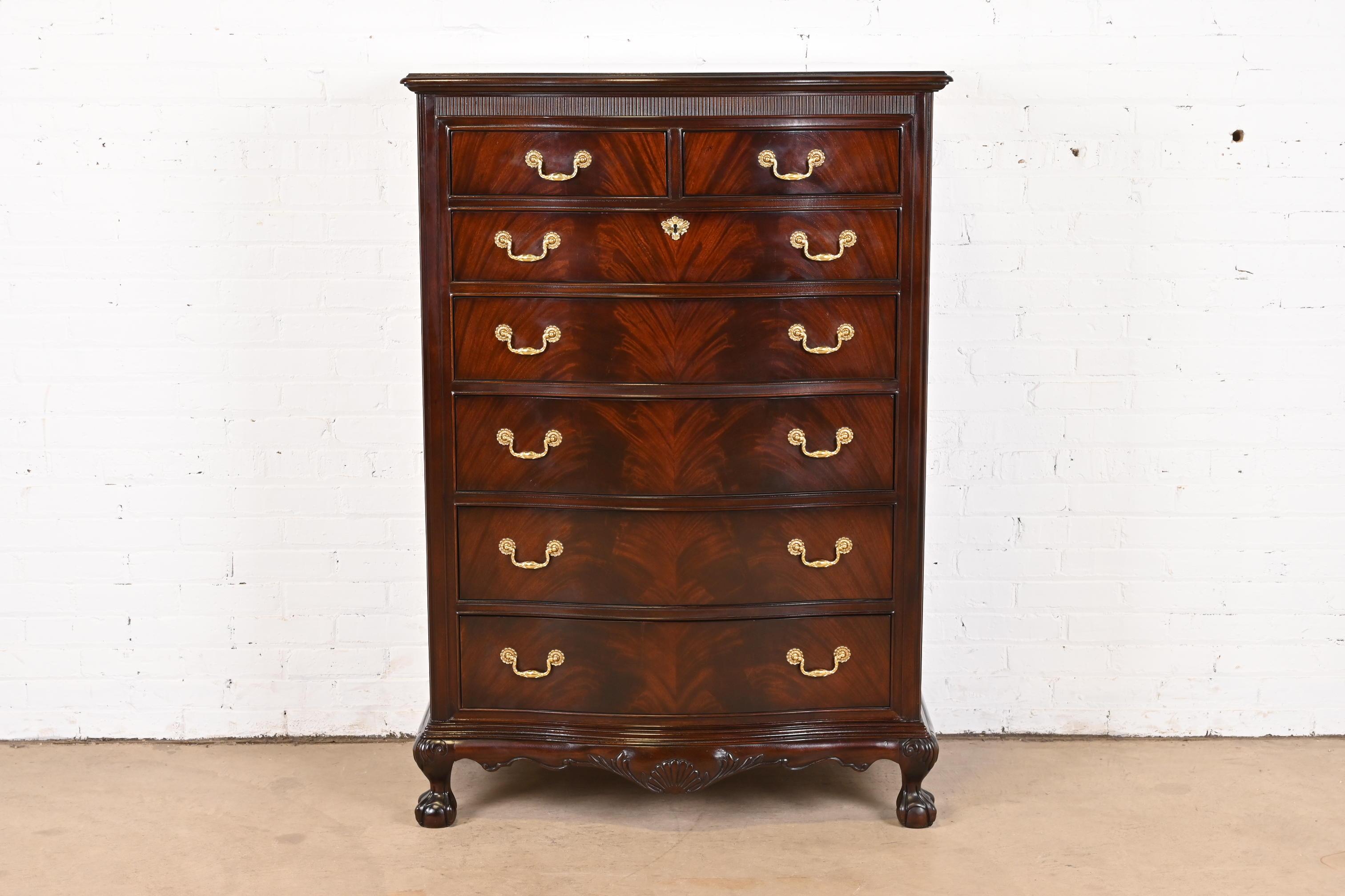 A gorgeous Georgian or Chippendale style seven-drawer highboy dresser

By Drexel Heritage

USA, Circa 1980s

Beautiful book-matched flame mahogany, with original brass hardware and carved ball and claw feet.

Measures: 38