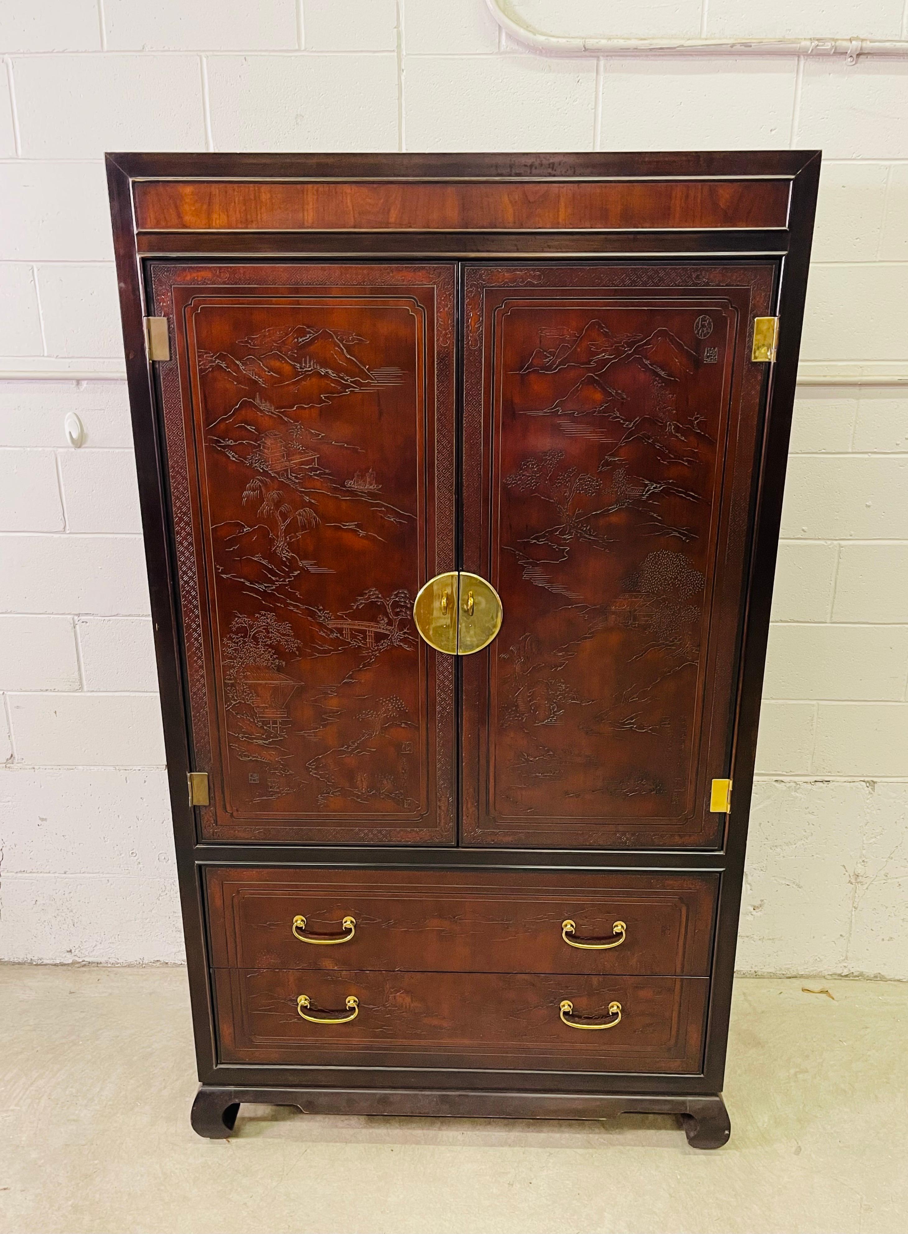 Vintage Drexel heritage armoire from the Connoiseur collection. This large armoire provides lots of storage with four large drawers and ample shelving. There is a mirror on the door and the armoire has brass accents. The outside of the armoire is