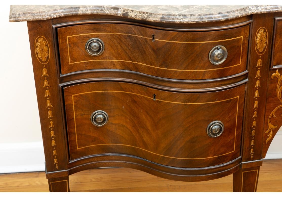 Drexel Heritage Covington Park Collection serpentine form, marble top sideboard cabinet. 
Inlaid mahogany. The sideboard's marble top lifts off for transportation or storage. 
The chest features inlaid detailing to the serpentine from cabinet.