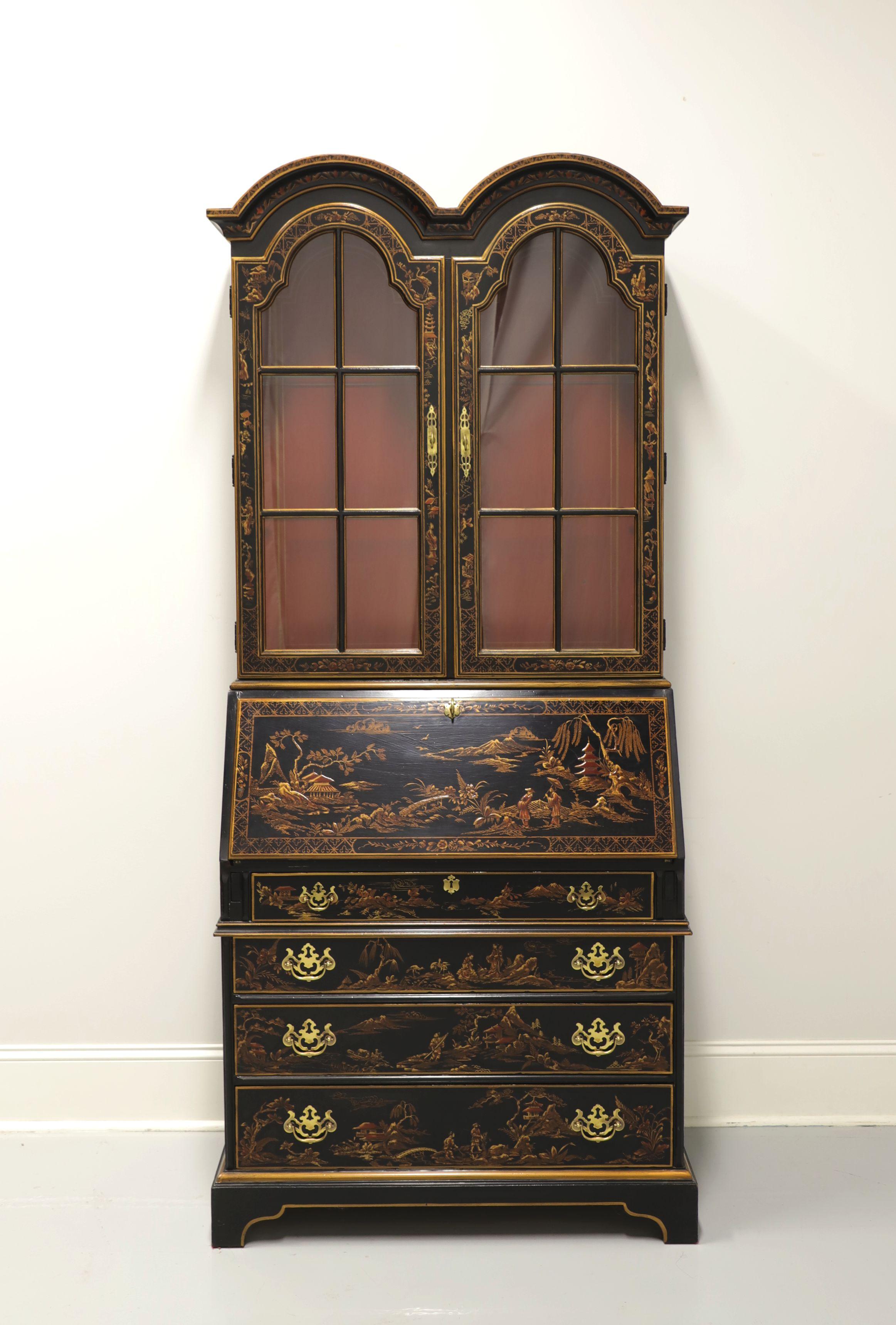 An Asian Chinoiserie style secretary desk by Drexel Heritage, from their Et Cetera Collection. Solid wood with black lacquer, hand painted Chinoiserie scene accents, double bonnet arched top, brass hardware and bracket feet. Upper lighted display