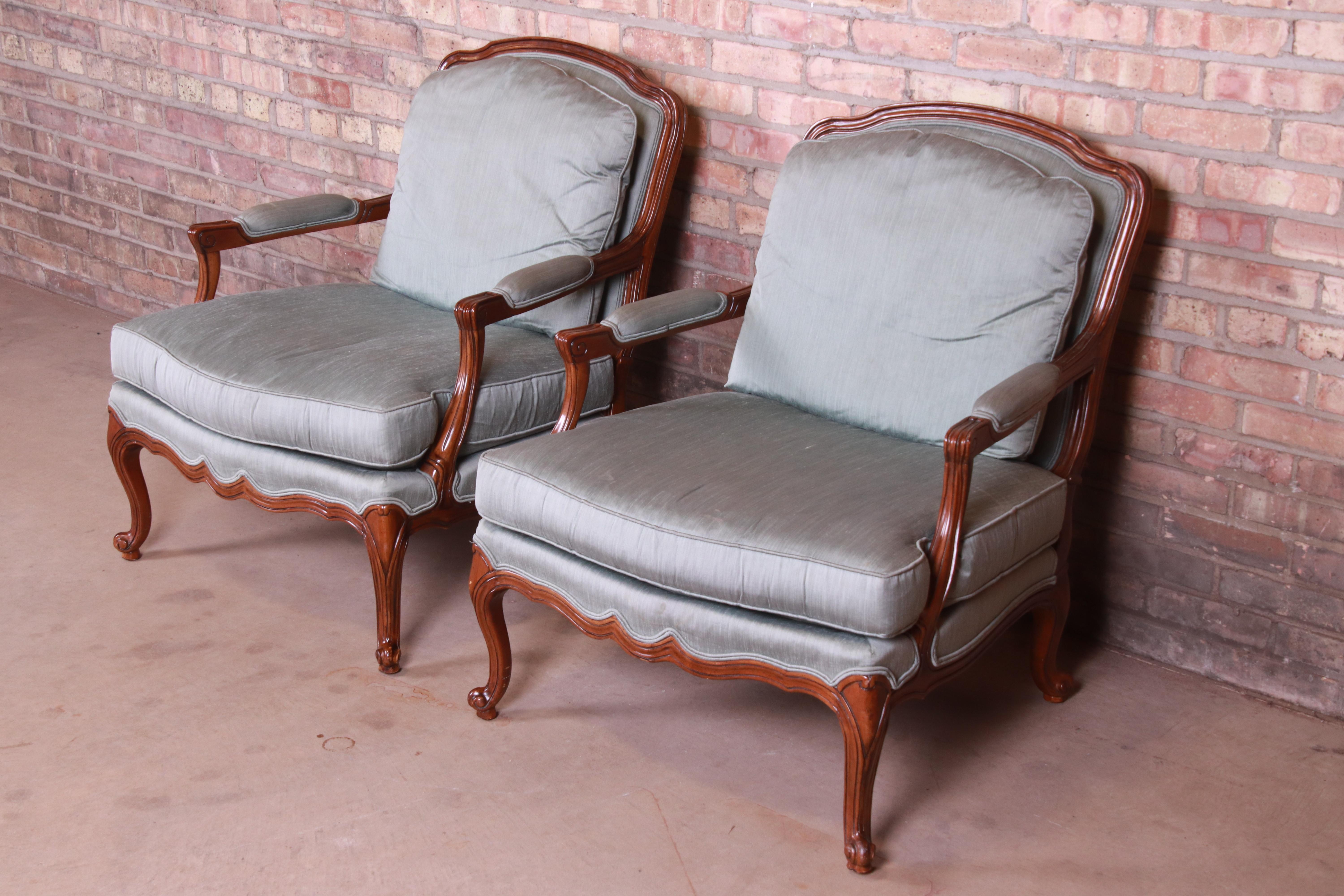 20th Century Drexel Heritage French Provincial Louis XV Carved Walnut Bergère Chairs, Pair