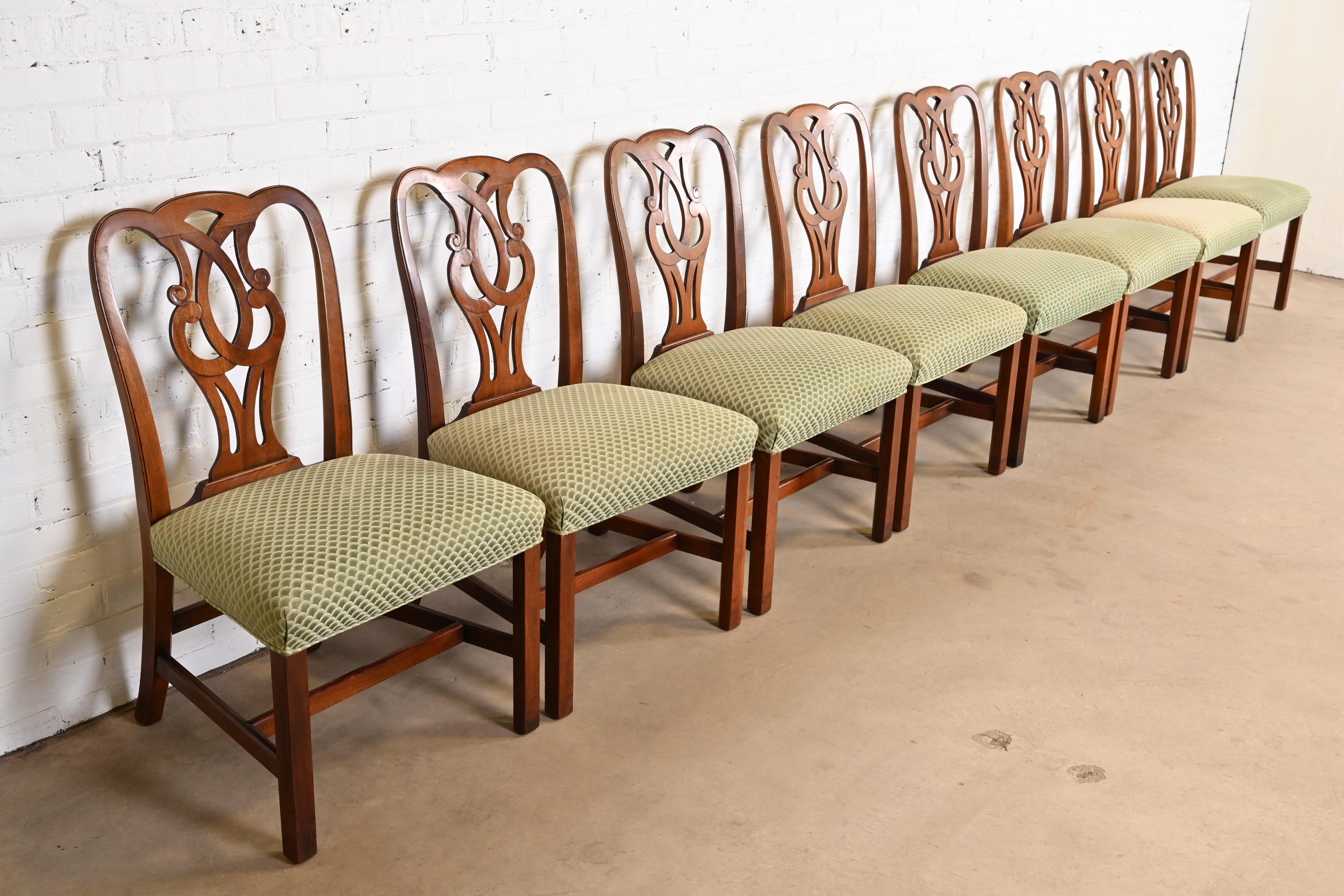 A gorgeous set of eight Georgian or Chippendale style dining chairs

By Drexel Heritage

USA, circa 1980s

Carved mahogany, with upholstered seats.

Measures: 23