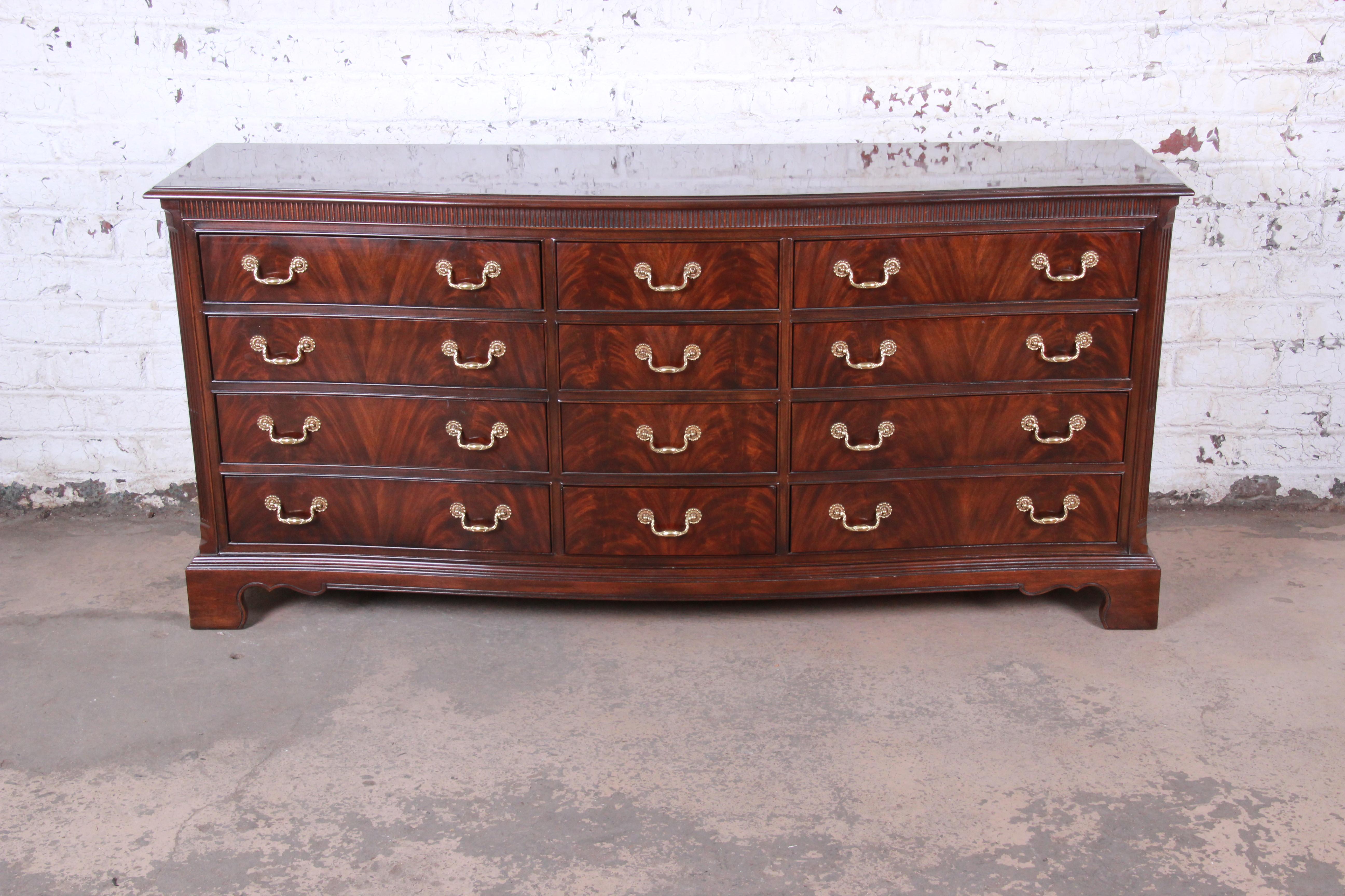 An exceptional Georgian flame mahogany twelve drawer triple dresser or credenza

By Drexel Heritage 