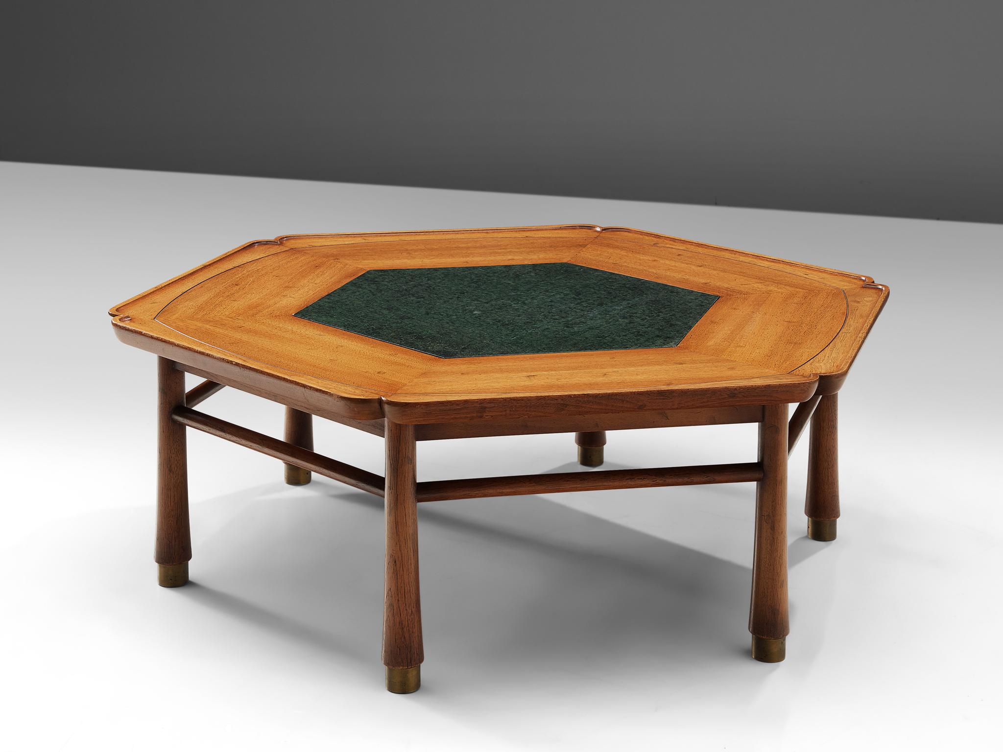 Drexel Heritage, coffee table, walnut, marble and brass, United States, 1970s

A hexagonal shaped coffee table in walnut, inlayed with beautiful marble. The corners and edges of the table are elegantly carved. The six tapered legs are finished
