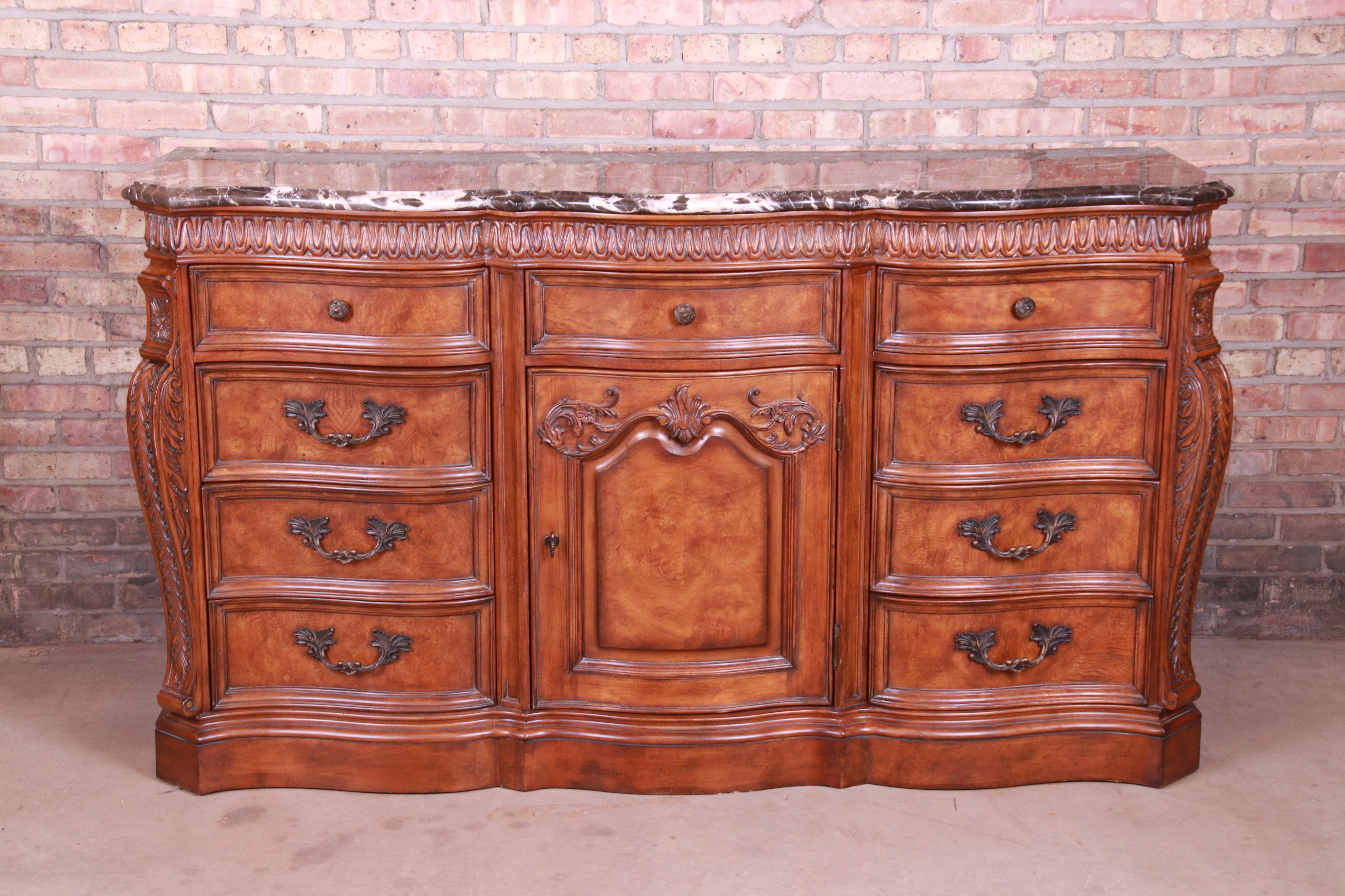A gorgeous Italian Provincial dresser, sideboard, or credenza

By Drexel Heritage

USA, late 20th century

Carved burled walnut, with beveled marble top and original brass hardware.

Measures: 72