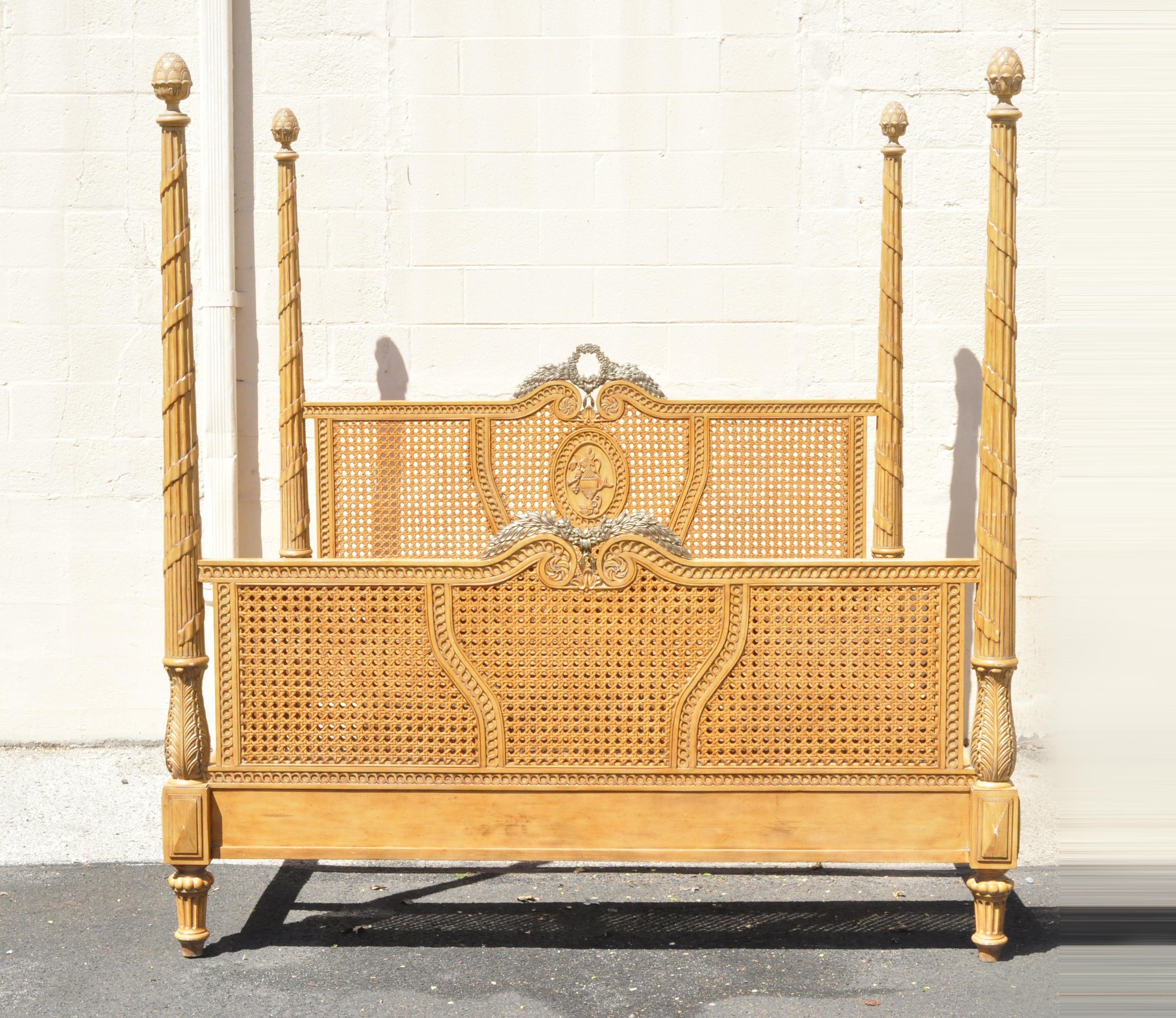 Drexel Heritage Legacy collection 4-post king size cane poster bed Italian style. Item features double cane footboard and headboard, cast metal wreath ormolu, tall carved posts, solid wood construction, distressed finish, nicely carved details,