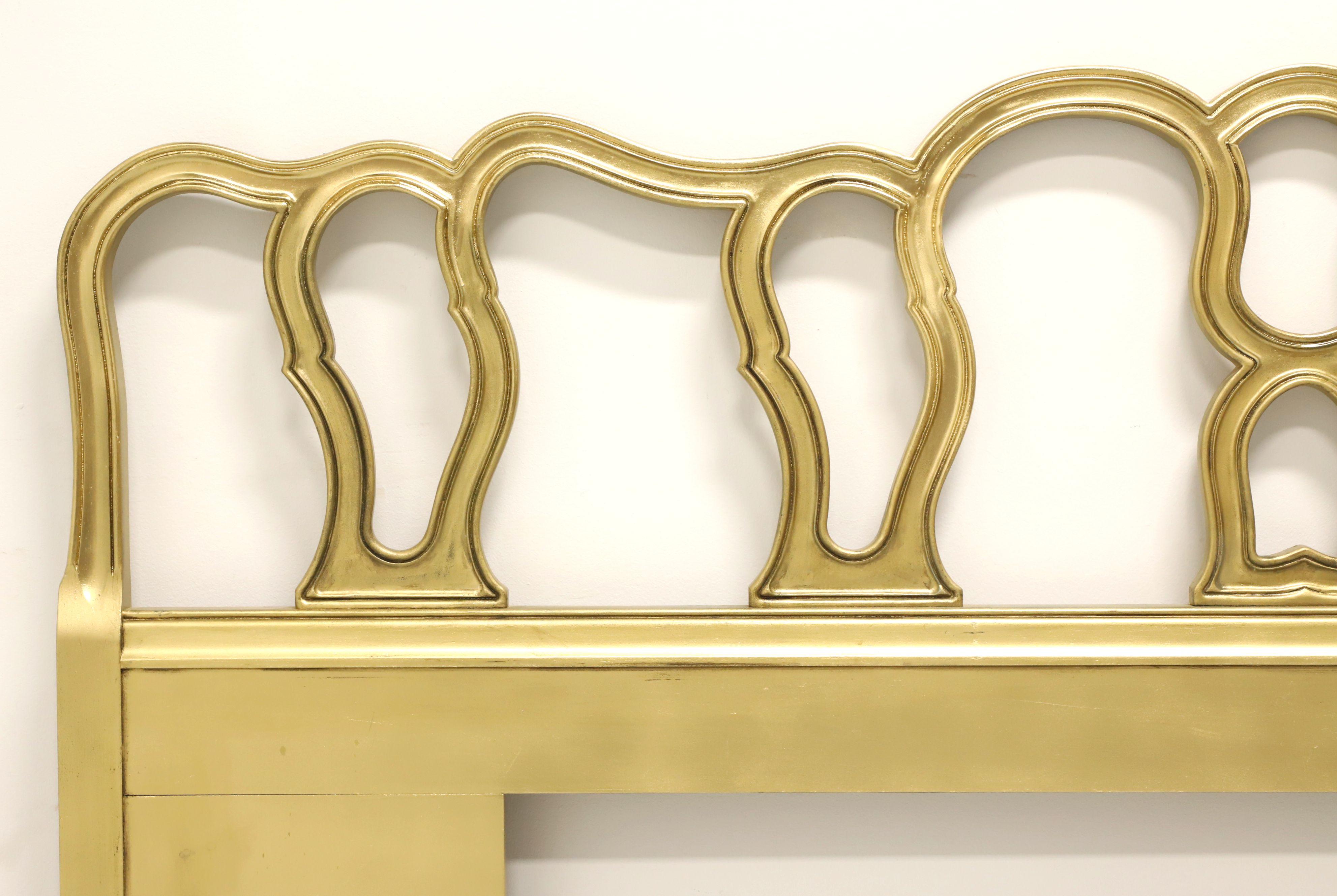 A French Provincial style king size headboard by Drexel Heritage, from their Bordeaux line. Solid wood painted a lighter shade of gold, decoratively carved pierced design with a serpentine shape. Made in North Carolina, USA, circa 1967.

Style #: