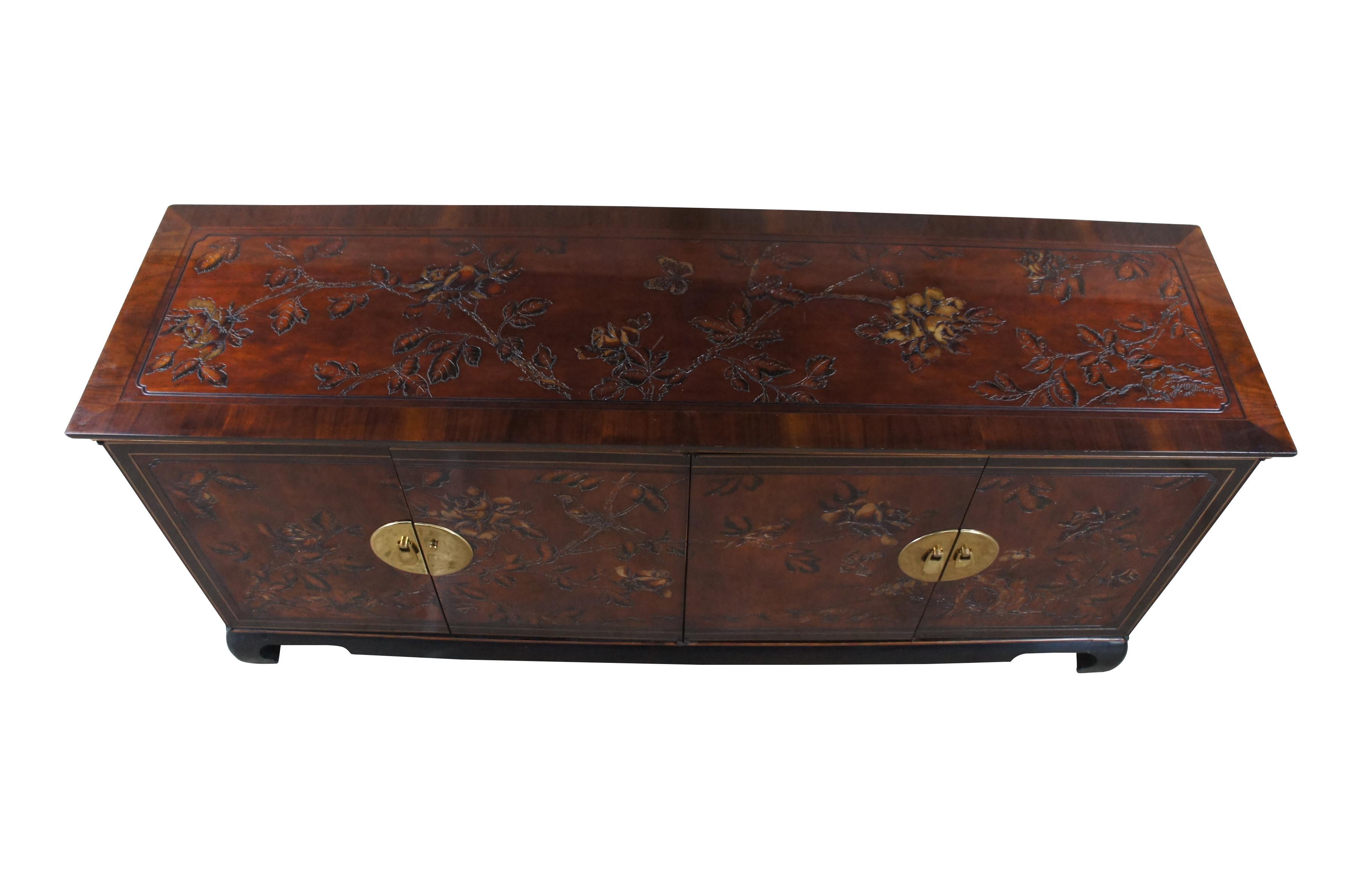 Vintage Drexel Heritage Connoisseur sideboard / buffet / credenza / console.  Made of mahogany featuring Hollywood Regency / Chinoiserie styling with embossed floral, bird and butterfly motif and brass hardware.  166-138

Dimensions:
19