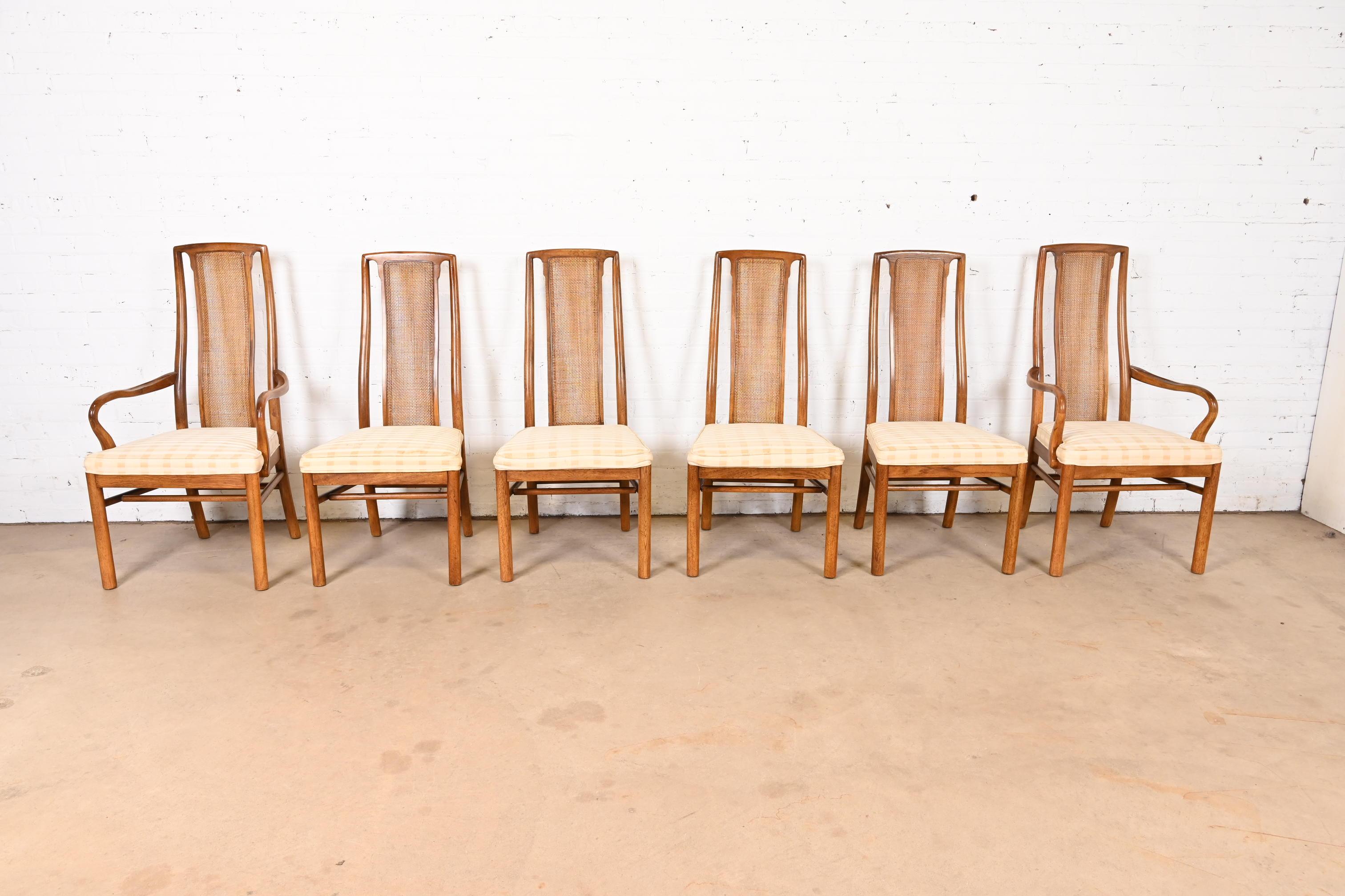 A gorgeous set of six of Mid-Century Modern high back dining chairs

By Drexel Heritage

USA, Circa 1970s

Walnut frames, with cane backs and upholstered seats.

Dimensions:
Side chairs: 20