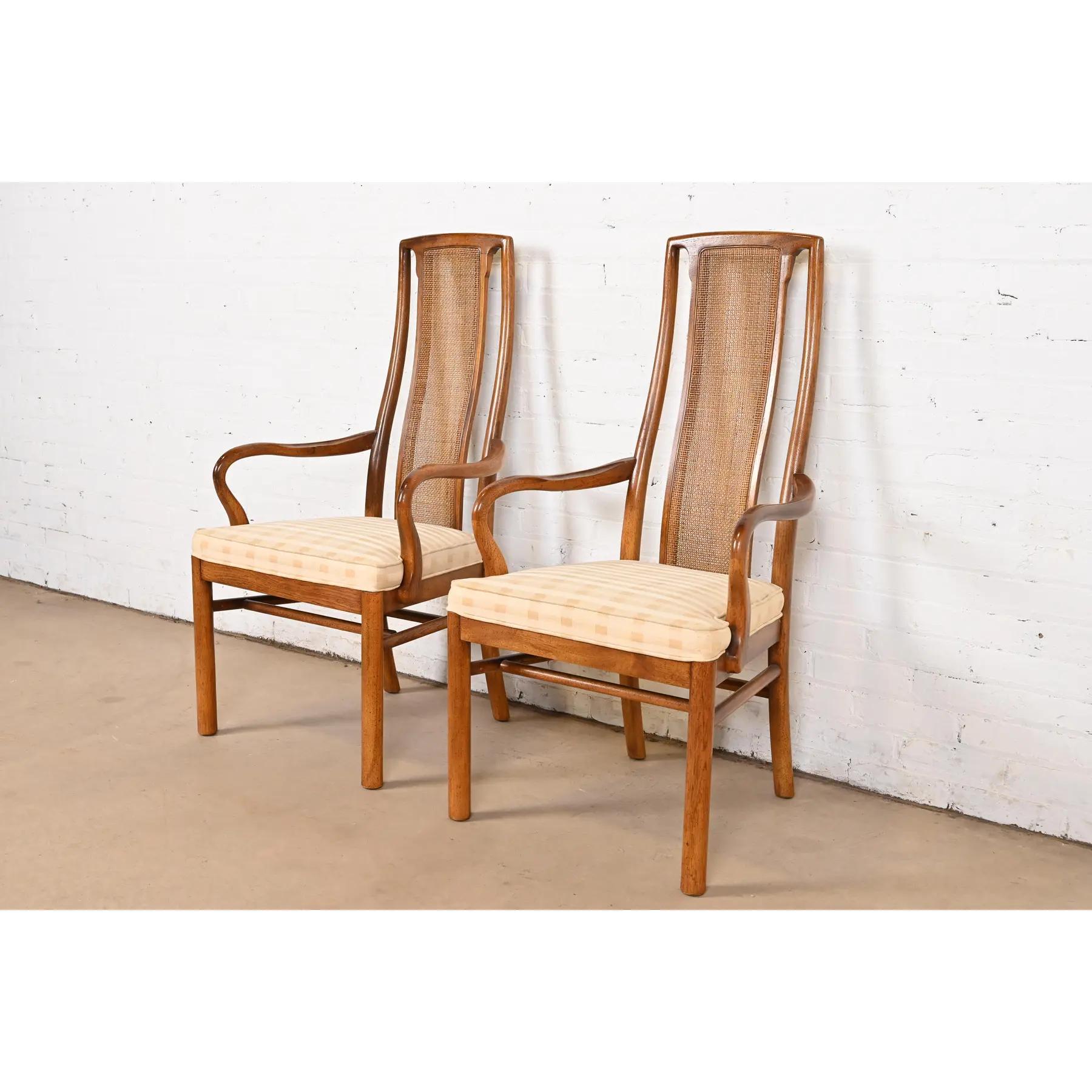 A gorgeous pair of Mid-Century Modern high back dining armchairs

By Drexel Heritage

USA, Circa 1970s

Sculpted walnut frames, with cane backs and upholstered seats.

Measures: 22