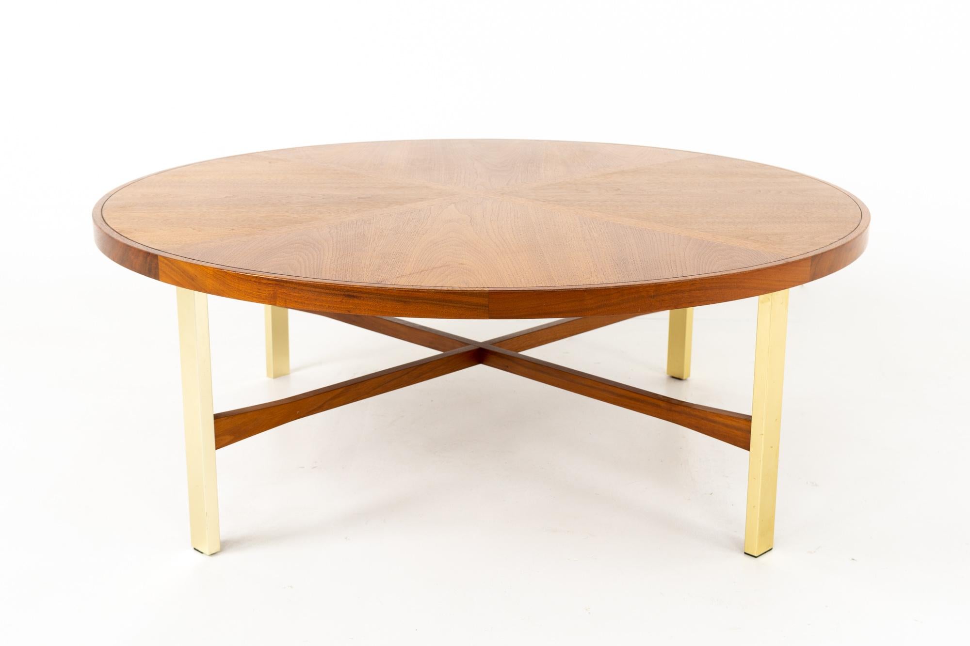 Drexel Heritage Mid Century walnut and brass round coffee table
This table is 42 wide and 42 deep by 15.25 inches high

This piece is available in what we call restored vintage condition. Upon purchase it is fixed so it’s free of watermarks, chips