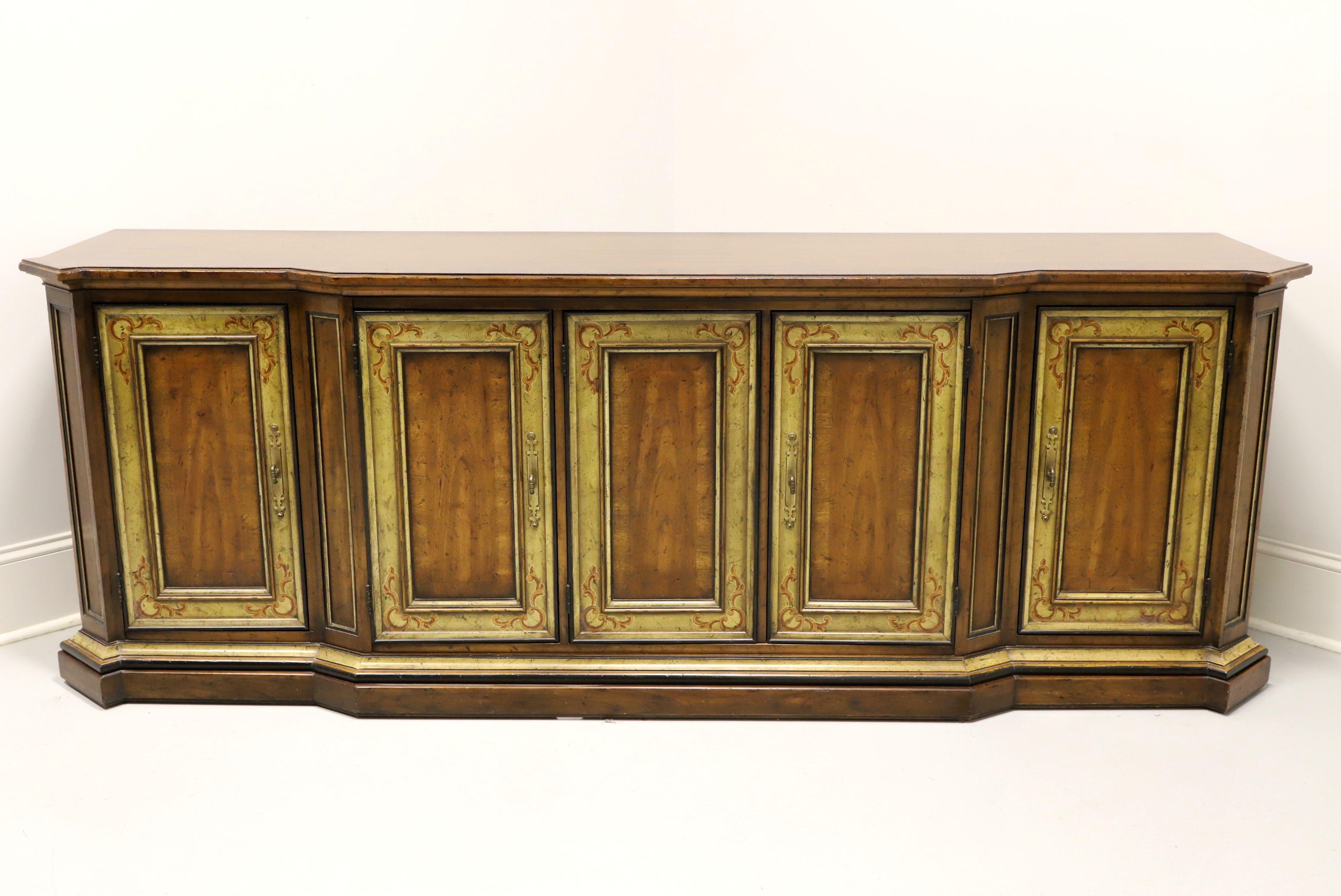 An oversized, French country style, credenza by Drexel Heritage, from their Sketchbook Collection. Mahogany with a distressed finish, banded distressed top, modified serpentine front, brass hardware, banded flame mahogany door fronts, painted
