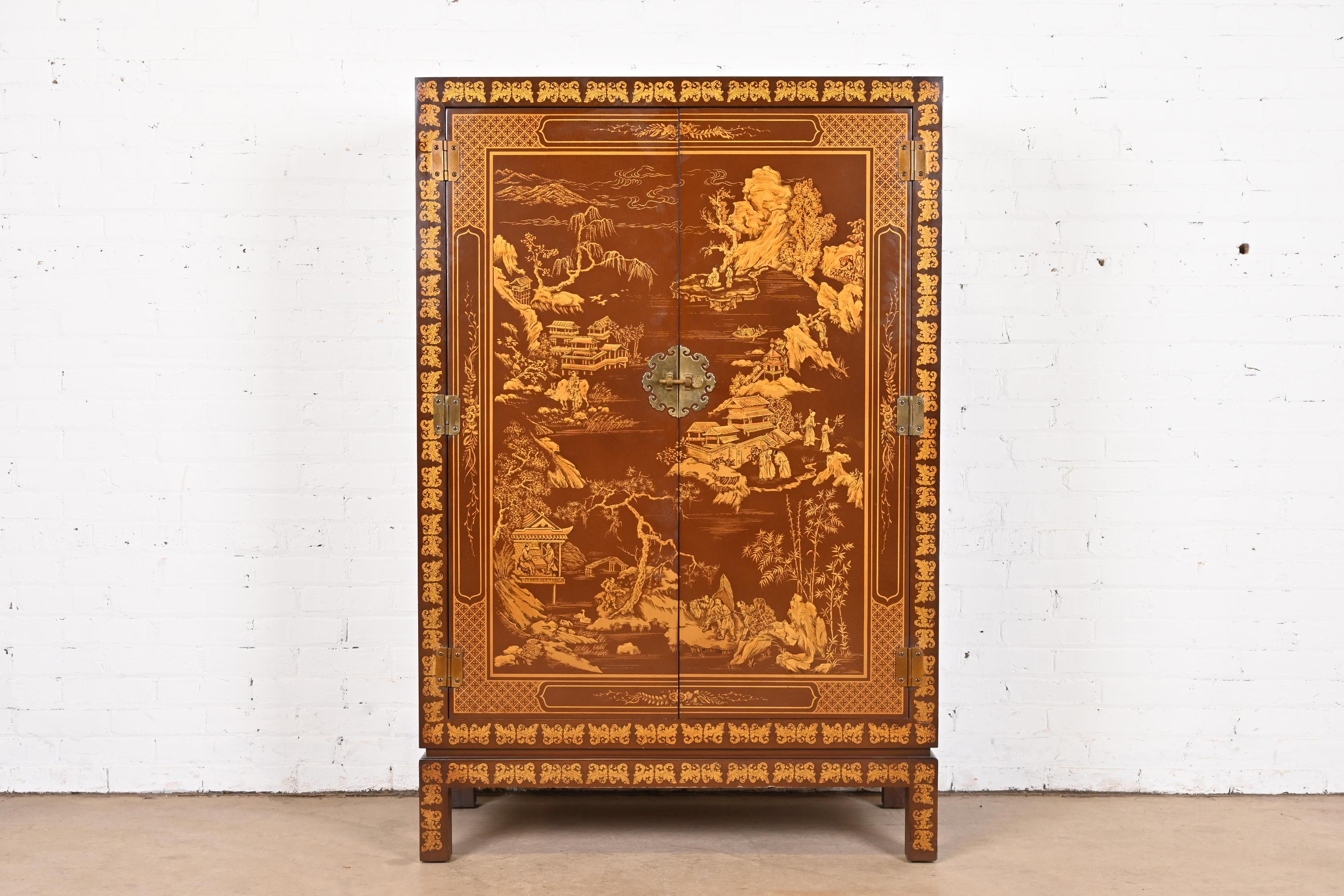 A gorgeous mid-century modern Hollywood Regency Chinoiserie style bar cabinet

By Drexel

USA, Circa 1970s

Brown lacquered mahogany, with gold gilt hand painted Asian scenes, and Asian-inspired brass hardware. Interior is lighted and has a mirrored