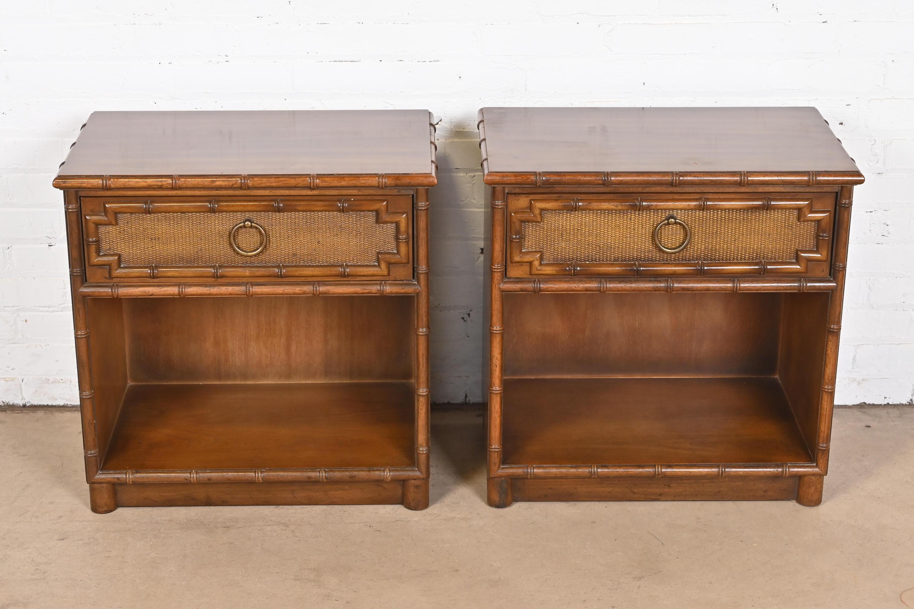A gorgeous pair of mid-century modern Hollywood Regency Chinoiserie style faux bamboo nightstands

By Drexel

USA, Circa 1970s

Carved walnut, with faux bamboo trim, rattan drawer fronts, and brass hardware.

Measures: 24