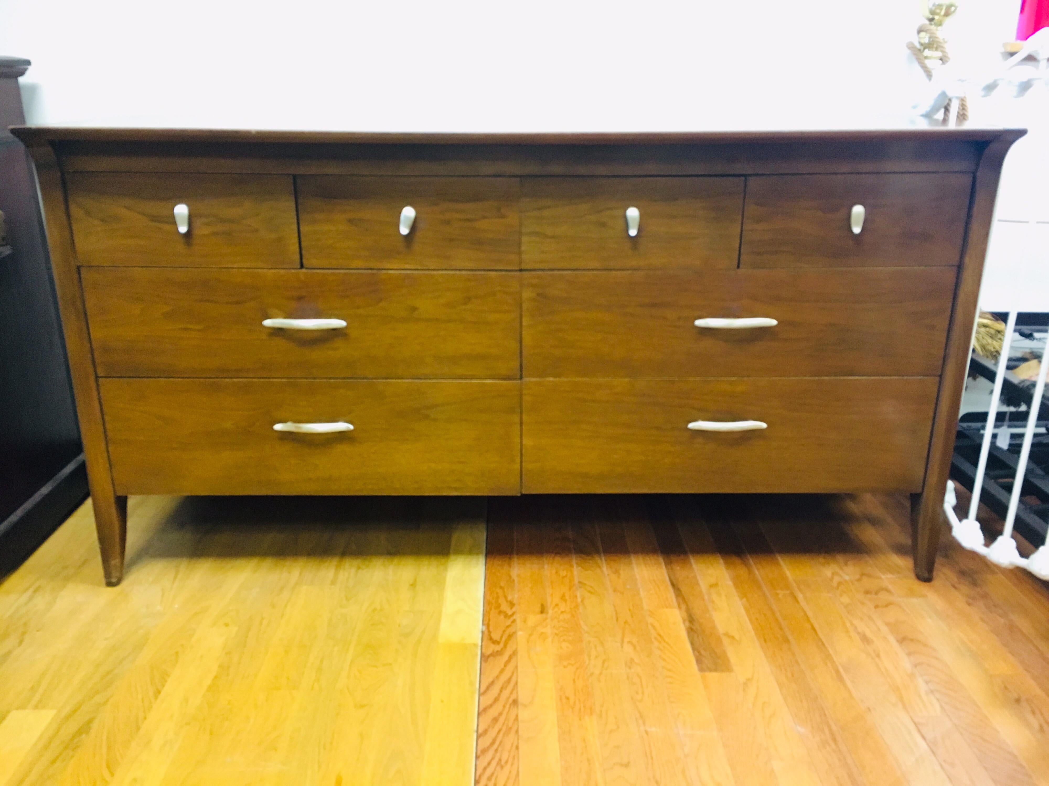 An elegant Mid-Century Modern eight-drawer dresser or credenza by John Van Koert for the 