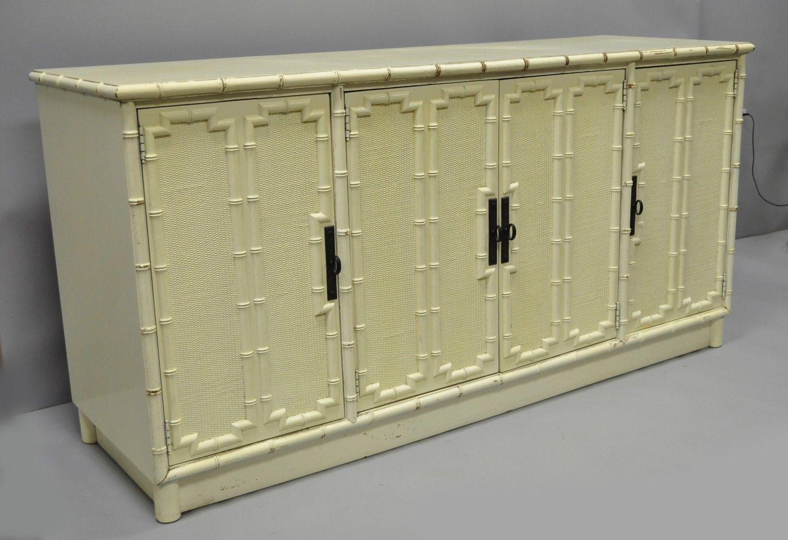 Drexel Kensington faux bamboo Hollywood Regency credenza cabinet. Item features one color lacquered finish, 3 dovetailed drawers, 4 swing doors, serial number #755-124-4, 2 wooden shelves, quality American craftsmanship, and great style and form;