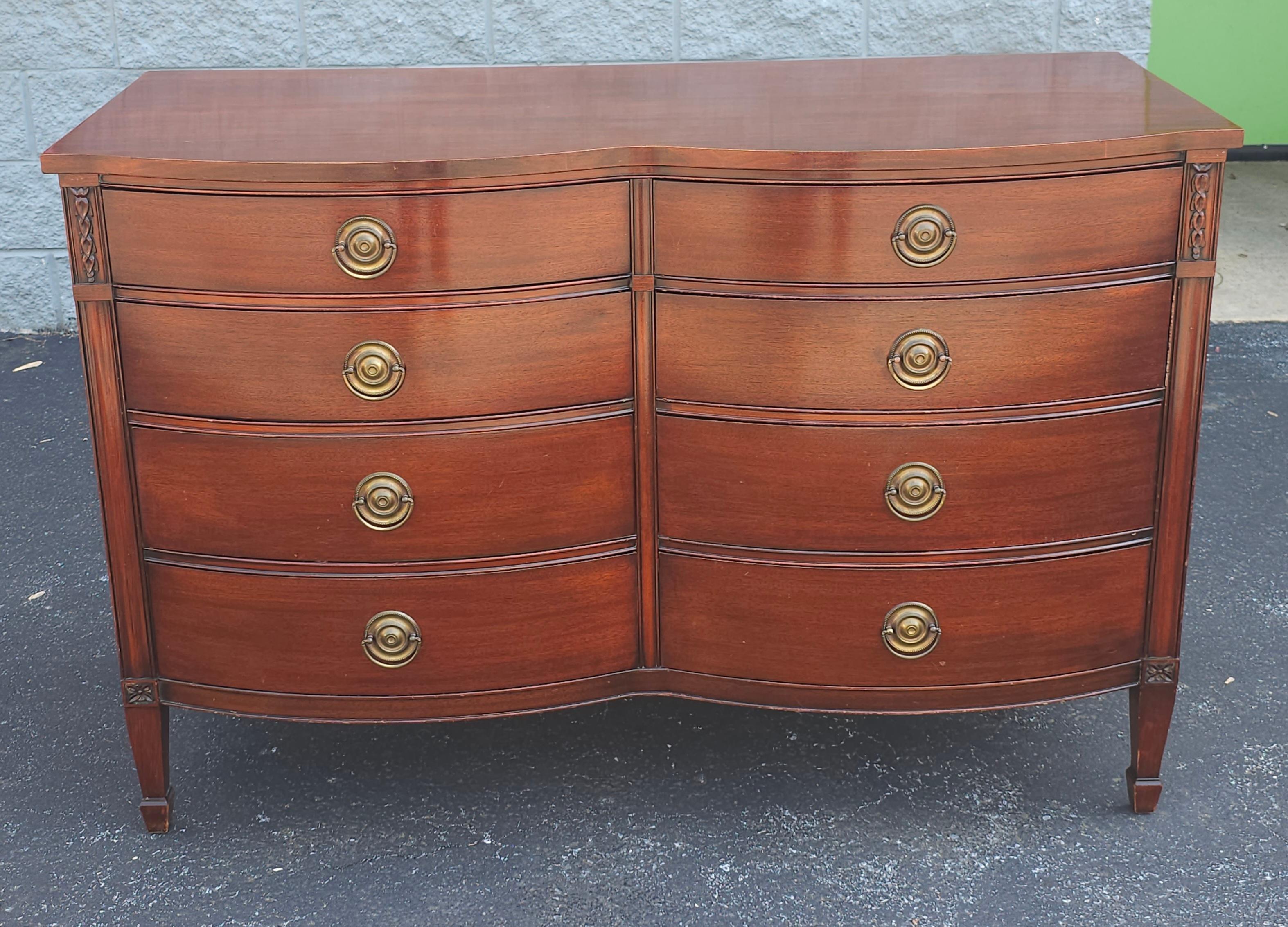 A clean Drexel Mid Century Federal Style Serpentine front Mahogany Double Dresser with protective  Glass Top. Measures 52