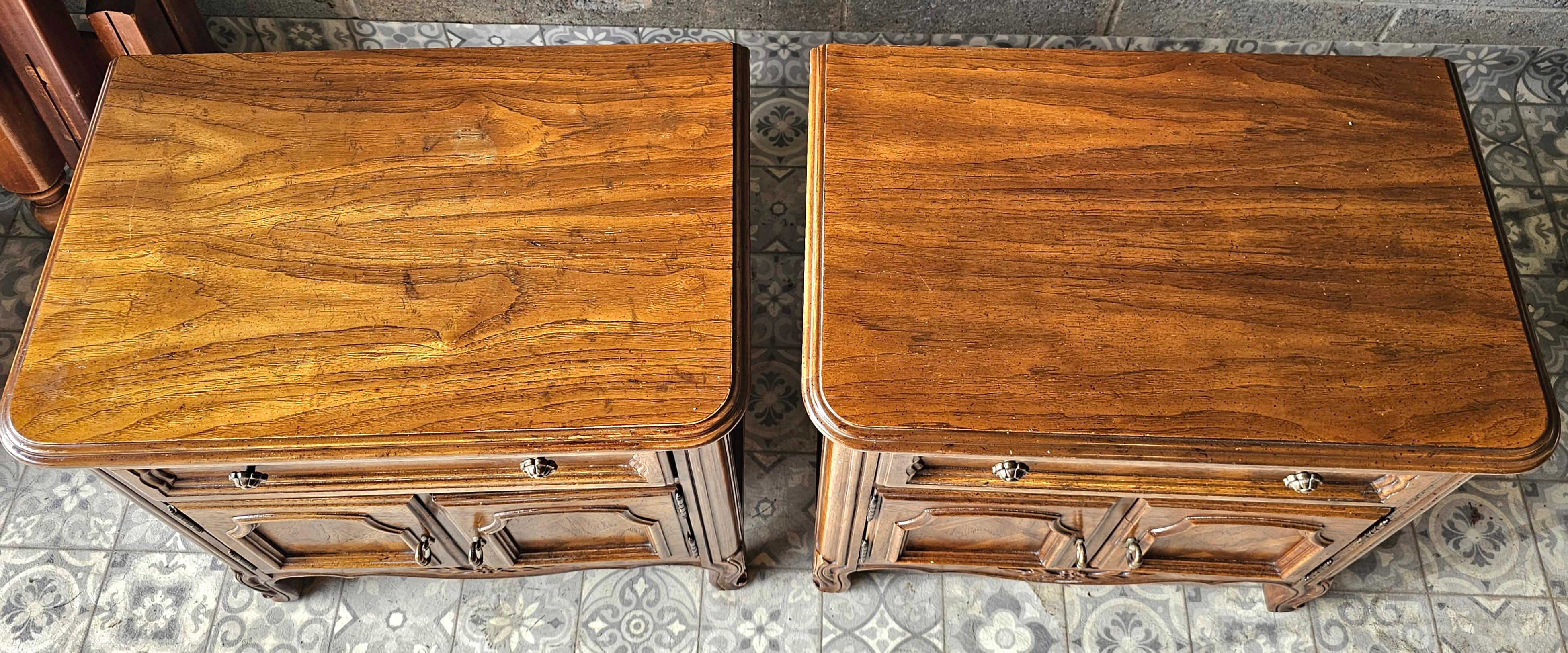 A pair of Drexel Mid-Century French Provincial Style Oak Bedside Tables
 Measures 25.5