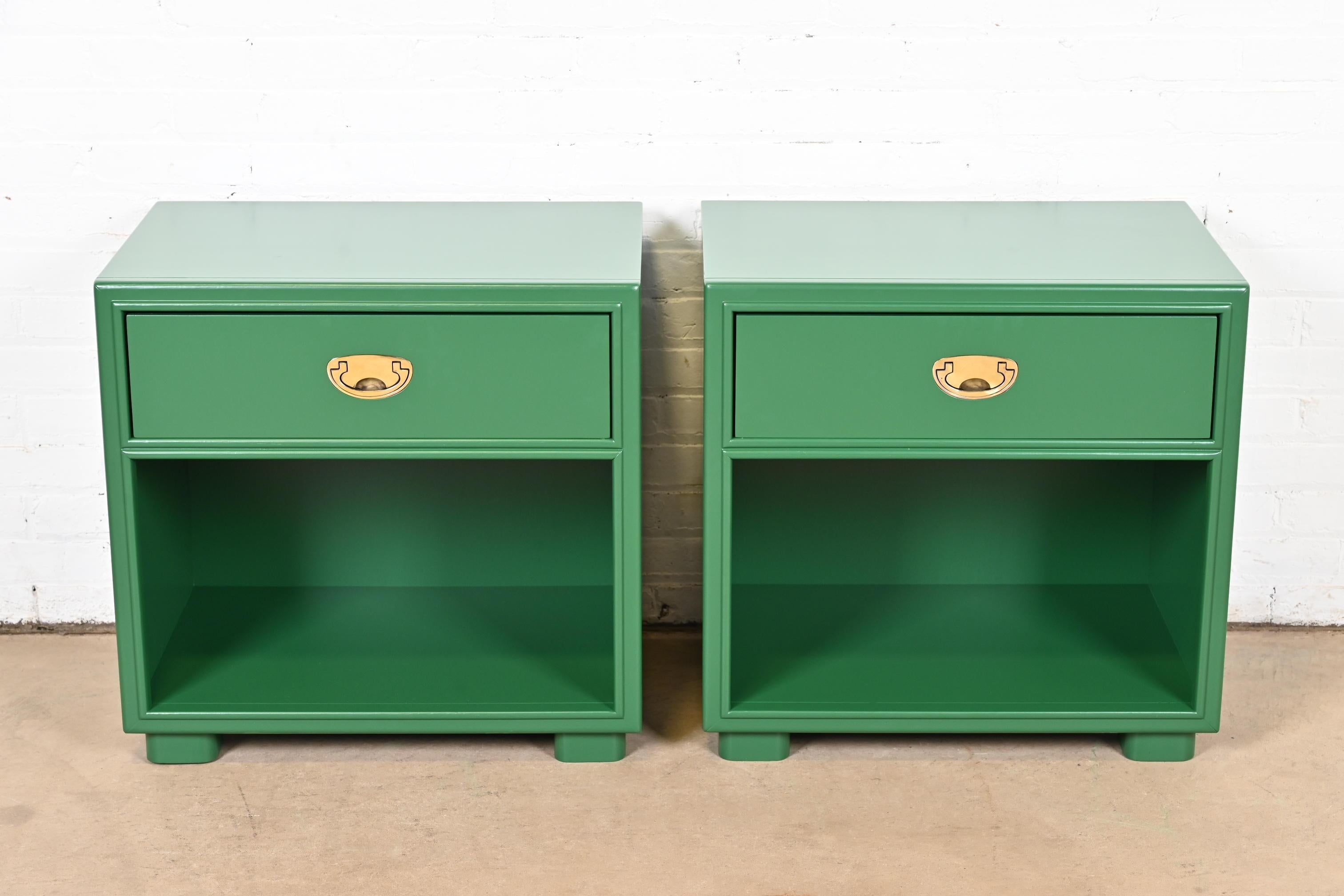 A gorgeous pair of mid-century modern Hollywood Regency Campaign style nightstands or bedside chests

By Drexel

USA, Circa 1970s

Green lacquered walnut, with original brass hardware.

Measures: 25