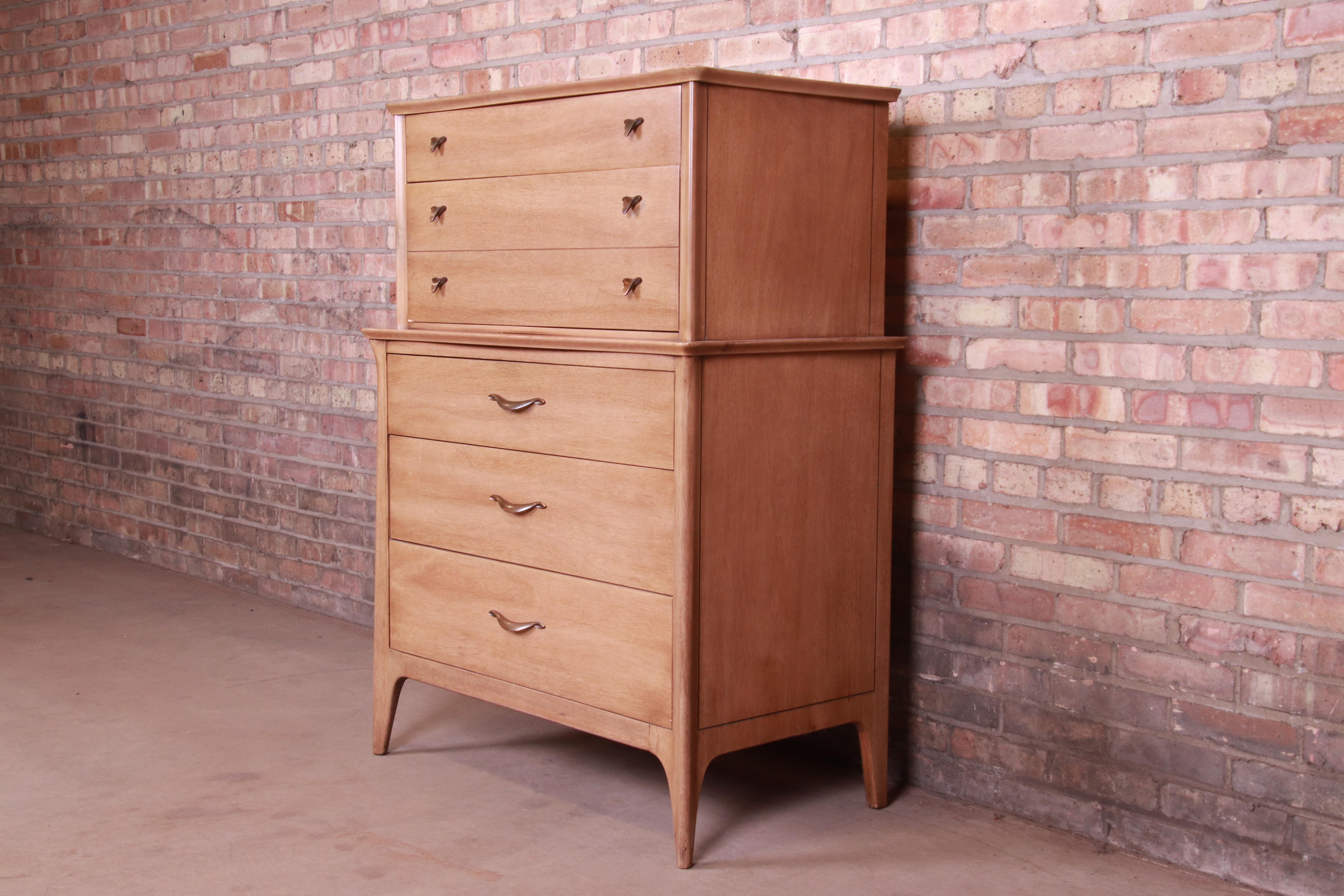 A beautiful Mid-Century Modern five-drawer highboy dresser

By Drexel

USA, 1950s

Bleached mahogany, with original brass hardware.

Measures: 35.75
