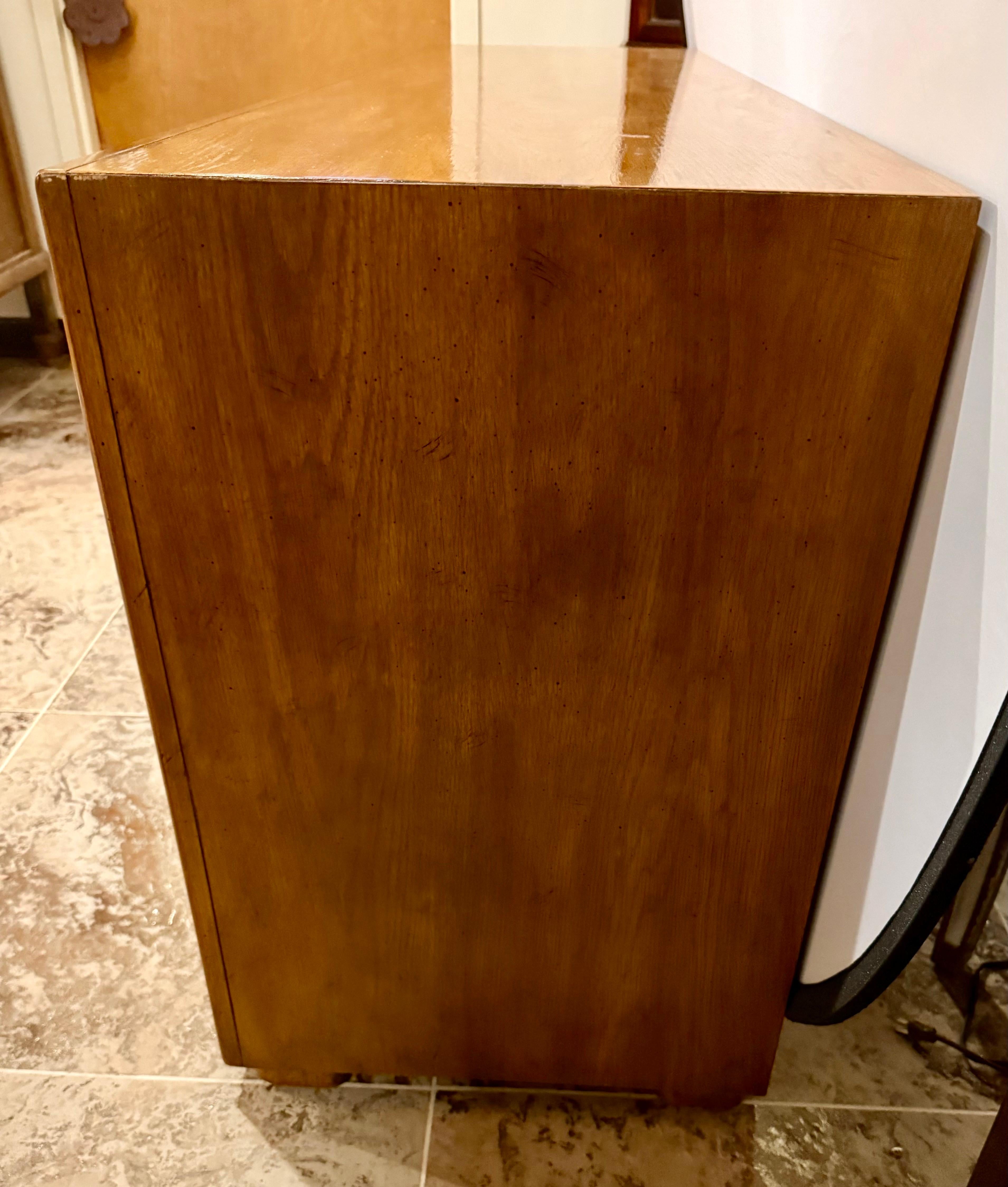 Rare and coveted Drexel nine drawer campaign style dresser.  Part of the ultra rare Passage line and one of two cases pieces in this style we have available this week exclusively on 1stDibs.  The other is also listed separately.