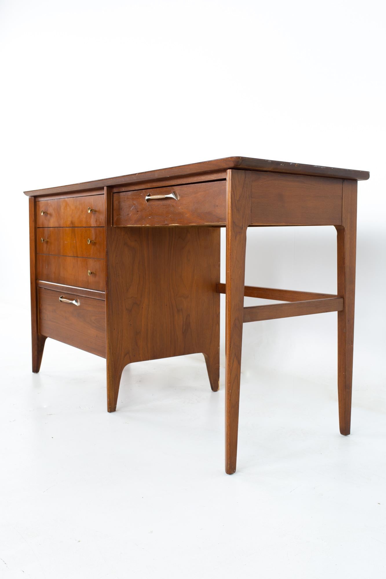 Drexel mid century walnut and Formica 4 drawer desk
Desk measures: 54 wide x 20 deep x 30 inches high 

All pieces of furniture can be had in what we call restored vintage condition. That means the piece is restored upon purchase so it’s free of