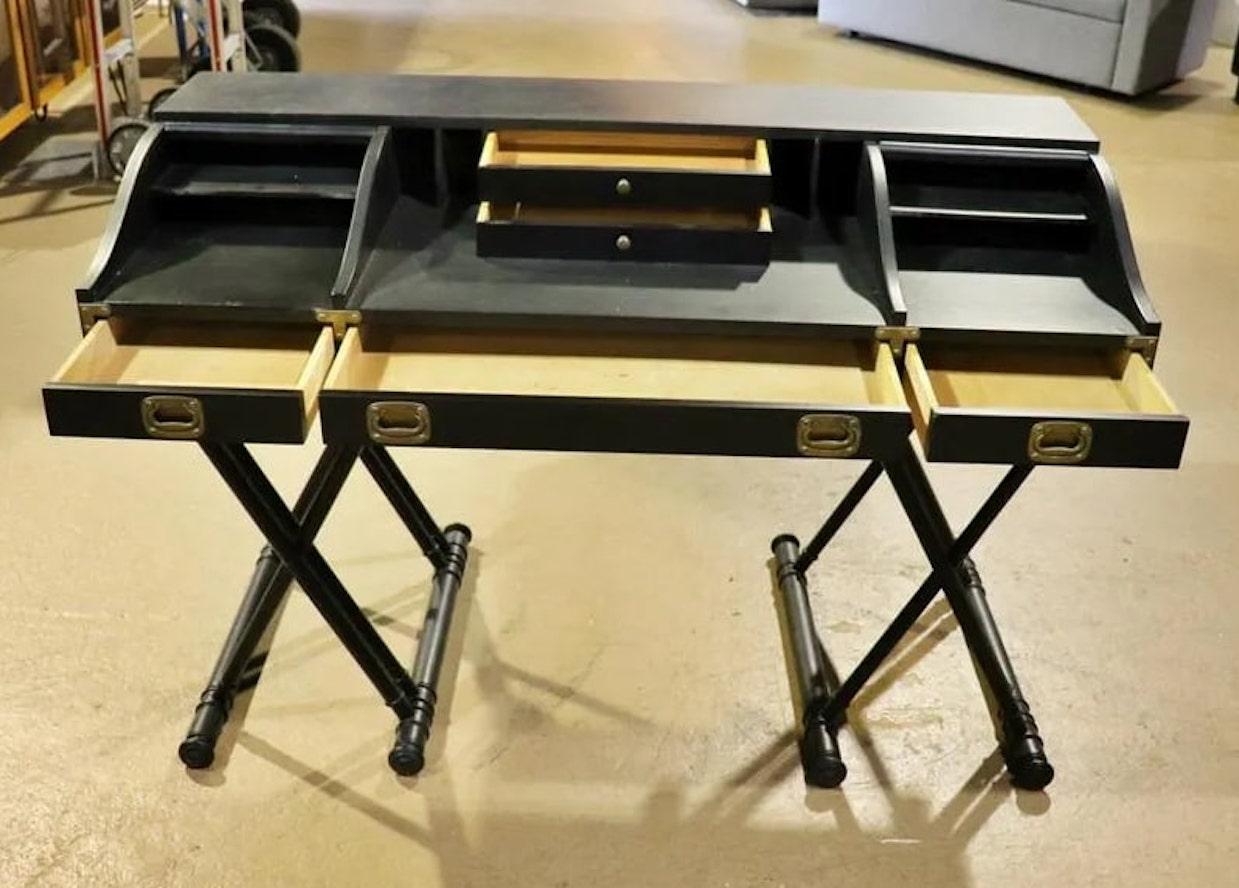 Large campaign style desk by Drexel with ebonized wood and brass hardware. Two roll top cabinets and two inset drawers.
Please confirm location NY or NJ.