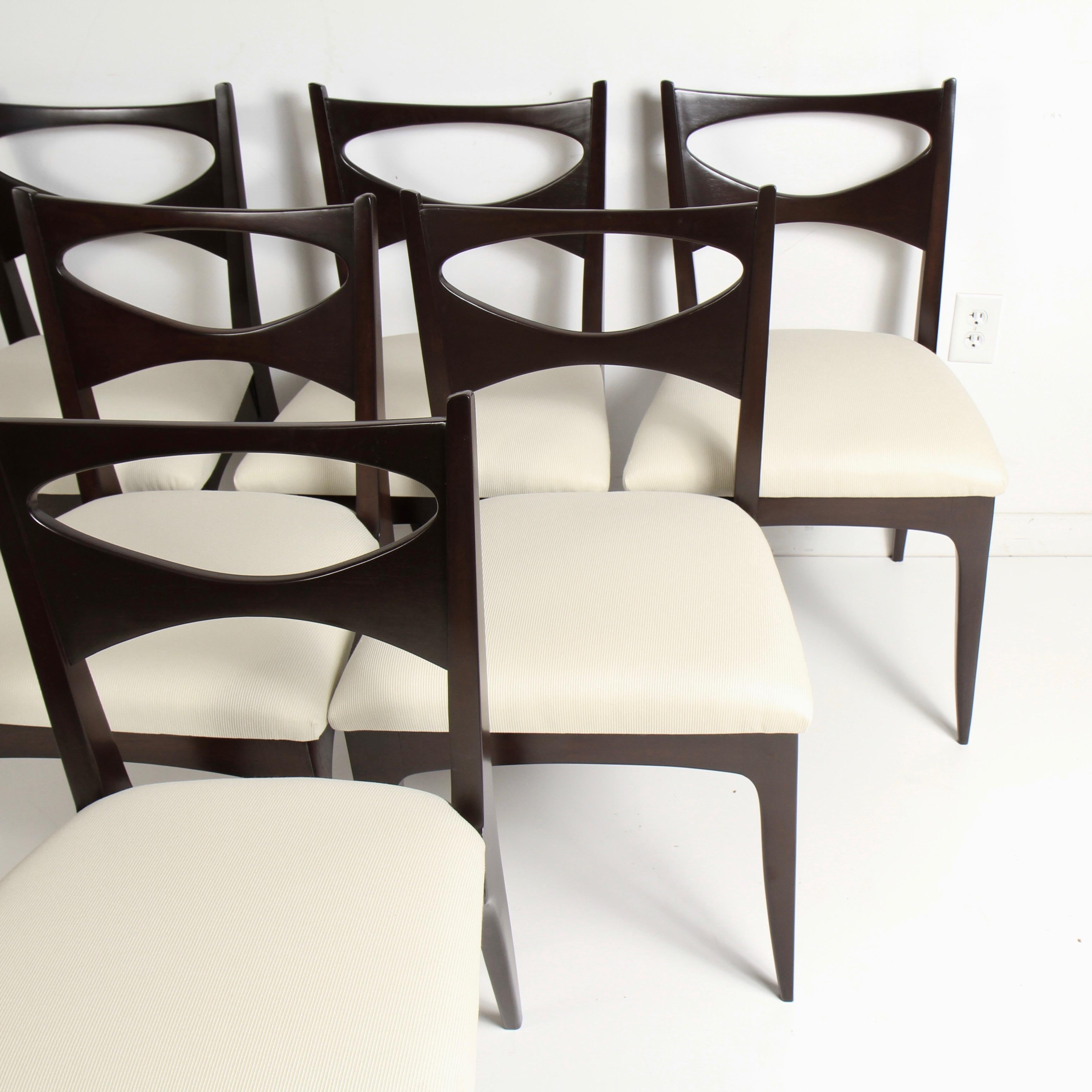 Set of six restored midcentury walnut Drexel Profile K62 dining chairs by John Van Koert. The Drexel Profile furniture collection was in production from 1955 to 1961. Van Koert started out as a jewelry designer for Harry Winston after WWII and later