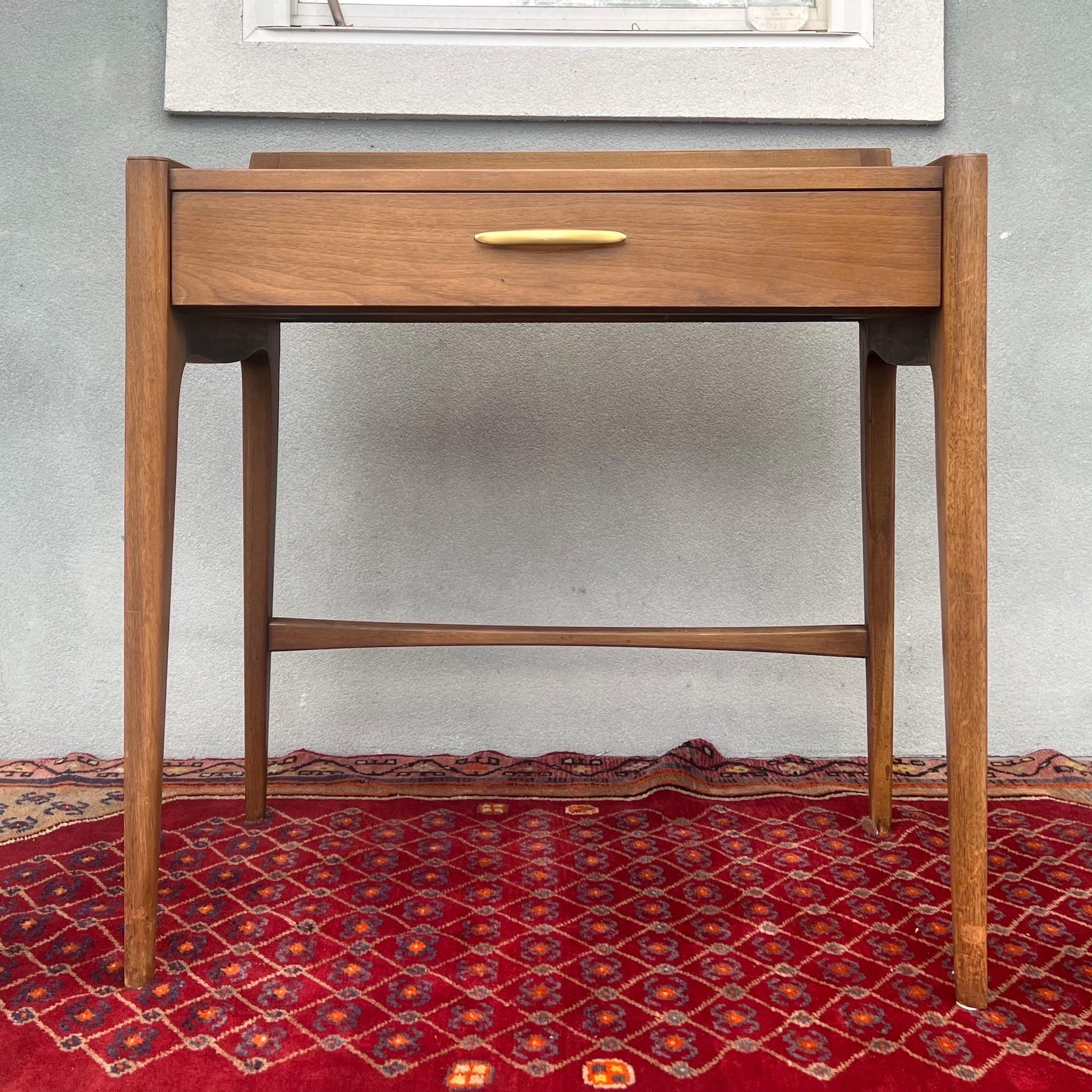 Vintage Mid-Century Modern vanity desk for your consideration. Designed by John Van Koert for Drexel in the 1950's, and part of the Profile series. This vanity/ single drawer writing desk/ console table is rare, and is in its original finish with