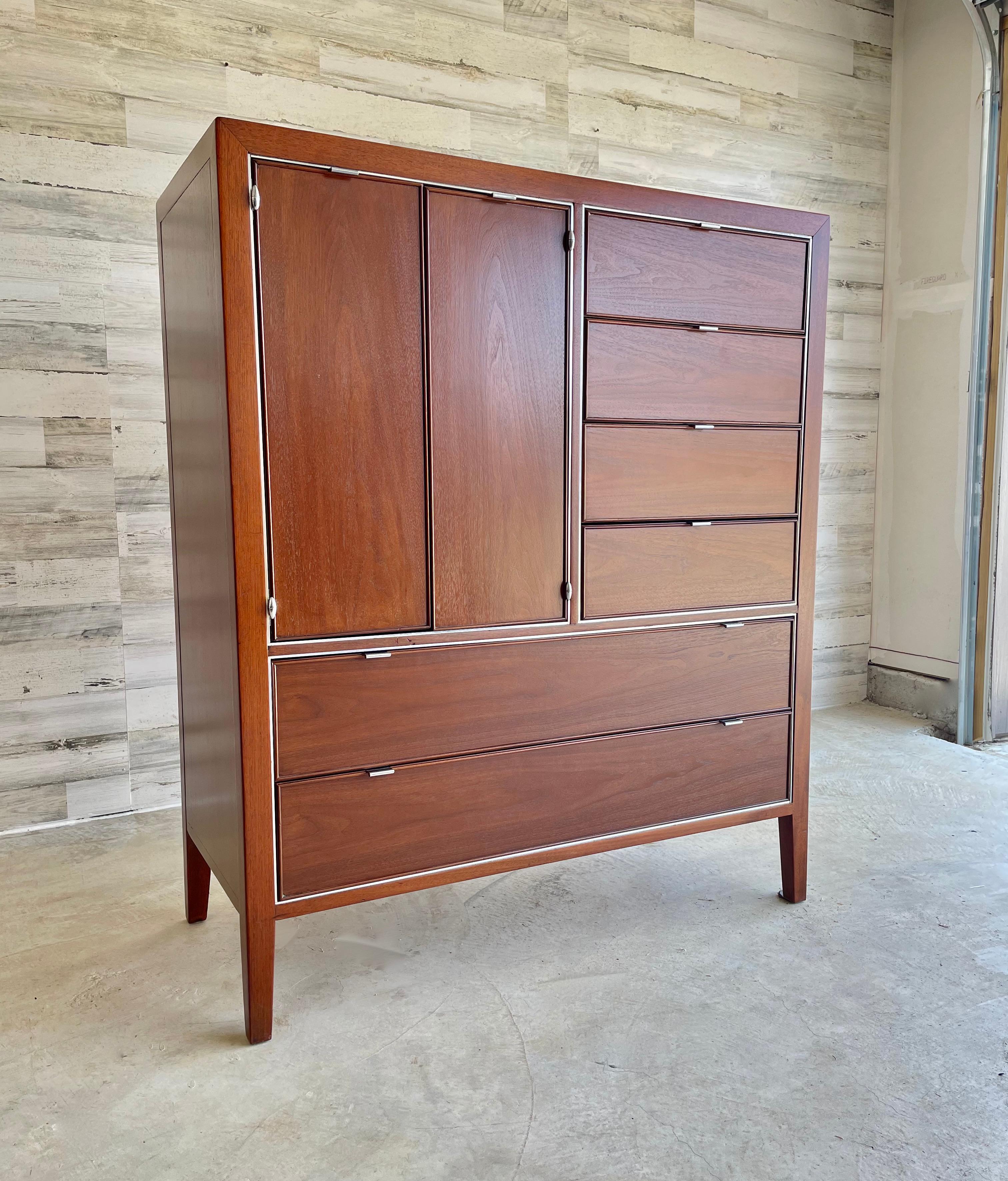Drexel Viewpoint 70 Gentlemen’s chest \ dresser. Tons of drawers for maximum storage. The left side drawers make a perfect jewelry storage space. Refinished in a walnut color with chrome trim and pulls.