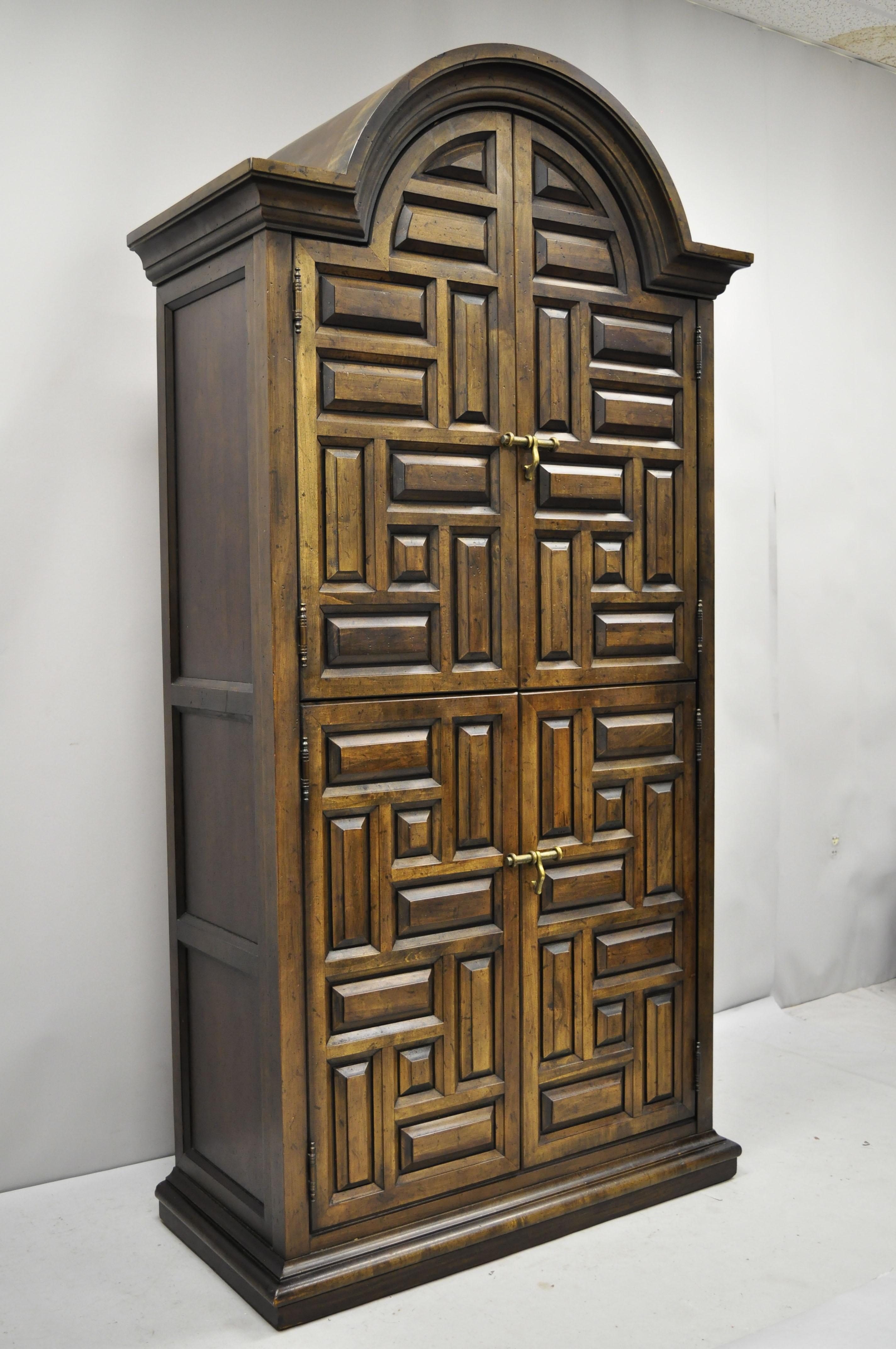 Drexel Villa Escalante Mediterranean Gothic Style Armoire Wardrobe Dresser Cabinet. Item features carved raised panel front and sides, solid wood construction, beautiful wood grain, 4 swing drawers, original stamp, serial number 708-402-2, 4