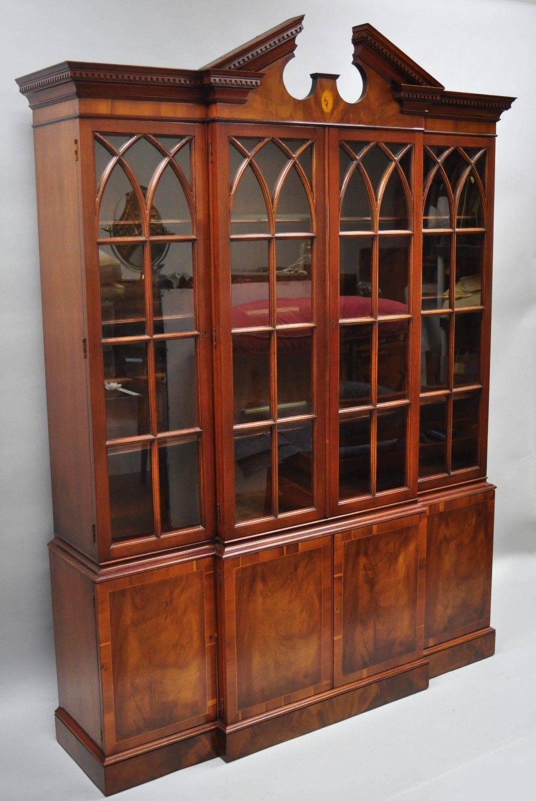 Drexel Wallace nutting mahogany breakfront, China cabinet Chippendale style. Item features individual panes of glass, beautiful woodgrain, two part construction, lighted interior, original label, working lock and key, three dovetailed drawers,