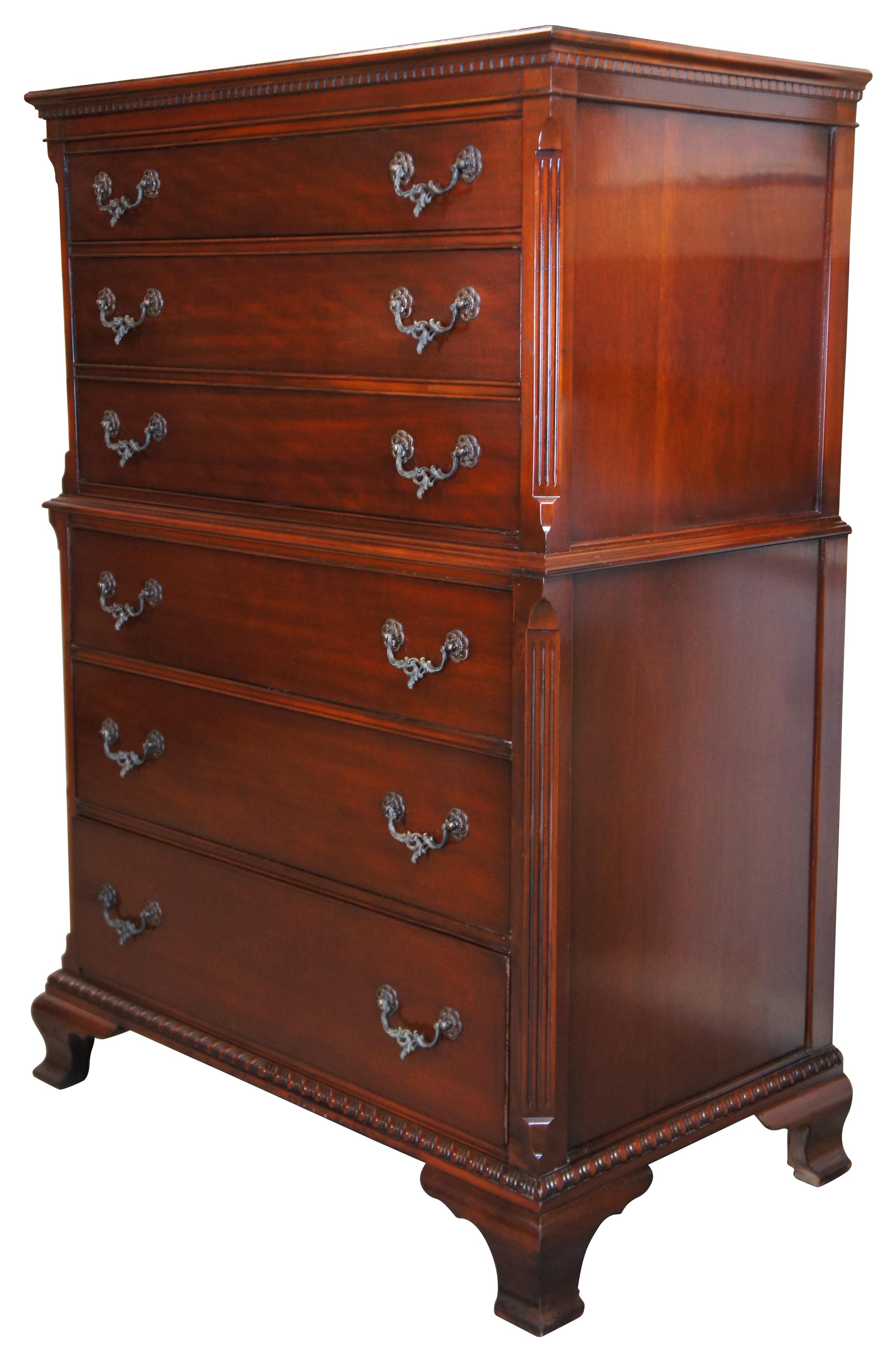 The Wentworth House Group mid-century chest of six drawers by Drexel Furniture. Made of mahogany featuring rectangular form with a chest on chest style design accented with fluted stiles terminating into rams tongues. Upper molding is highlighted by